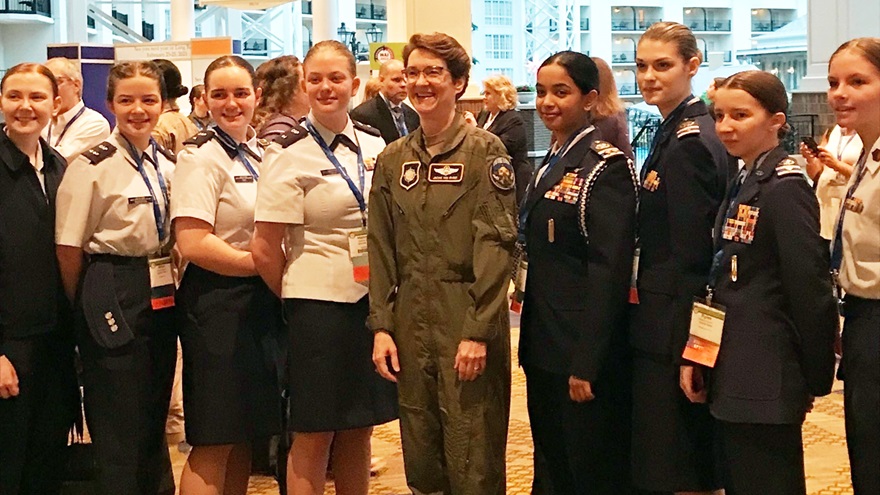 U.S. Air Force Gen. Jacqueline Van Ovost, center in flight suit, said the military is taking steps to make careers (including aviation careers) more appealing, and to see to it that aviation is no longer a "boys club" at the 2022 International Women in Aviation Conference in Nashville, Tennessee. Photo by Jill Tallman.