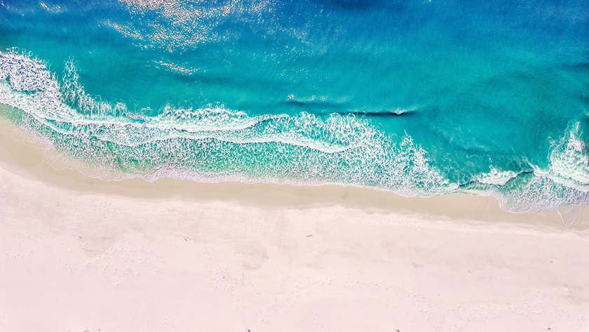 Crystal blue waters wash ashore the sand at Gulf Shores Beach. Photo courtesy of Tyler Bradfield.