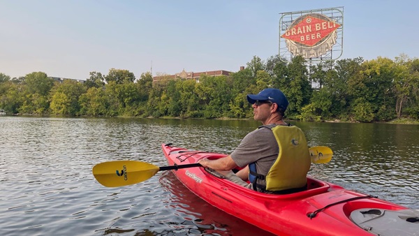One of many remnants of Minneapolis’ development we paddled by on the Heart of Minneapolis kayak tour: an 80-year-old, restored 50-foot-by-40-foot freestanding Grain Belt Beer neon sign in the shape of a bottle cap, which is even more magnificent at night. Photo by MeLinda Schnyder. 