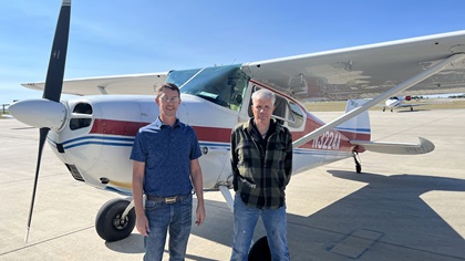 Hangar 9 FBO Director of Operations Wade Outka, left, and A&P mechanic Daryl Theobald pose with the AOPA Sweepstakes Cessna 170 after completing repairs. Hangar 9 FBO is located at Aberdeen Regional Airport. Photo by Erick Webb.