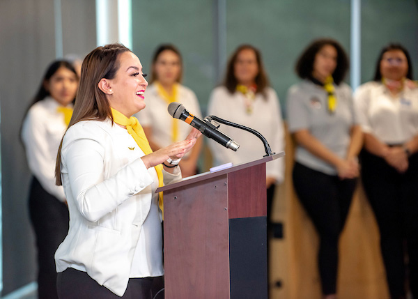 'Latinas in Aviation' author and certificated sport pilot Jacqueline Ruiz speaks to attendees at the 2022 Latinas in Aviation Global Festival hosted at College Park Airport in Maryland. Photo courtesy of the Department of Parks and Recreation, Prince George's County. 