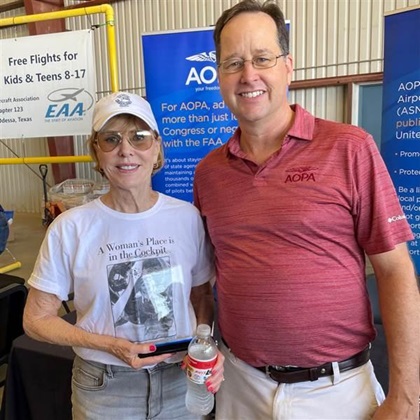 AOPA Central Southwest Regional Manager Tom Chandler presented Airport Support Network volunteer and pilot Vicki Hurt with an award recognizing her successful effort to rally support for Midland Airpark in Texas. Photo courtesy of Tom Chandler.