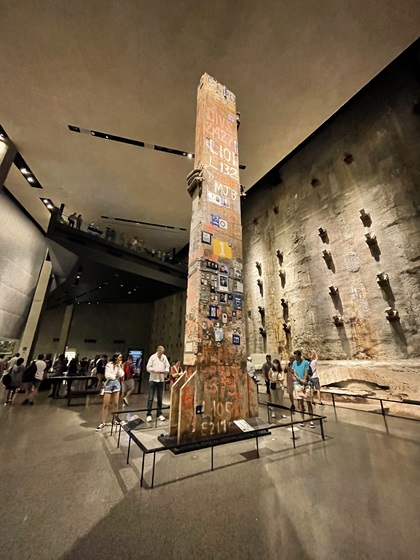 The removal of the last steel piece from the site of the World Trade Center in 2002 marked the end of recovery efforts at ground zero. Today the artifact, known as “The Last Column,” is on display in the 9/11 Memorial Museum’s Foundation Hall where visitors can learn the history behind the column’s preserved handmade tributes. Photo by Cayla McLeod.