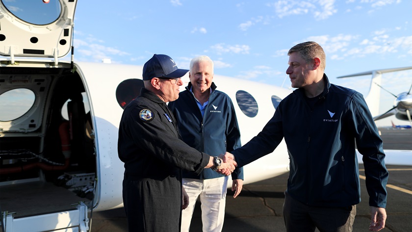 Test pilot Steven Crane gets a congratulatory handshake from Eviation Aircraft President and CEO Gregory Davis with company Chairman Richard Chandler looking on following a successful maiden flight. Photo courtesy of Eviation Aircraft Inc.