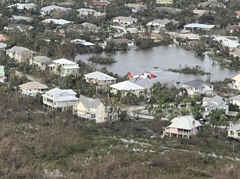 U.S. Coast Guard aircrews hoisted people from flooded areas near Sanibel, Florida, in the wake of Hurricane Ian on September 29. Sanibel Island and Captiva Island were cut off from the mainland after causeways and bridges washed out and only aircraft and boats could reach stranded storm victims. U.S. Coast Guard photo by Auxiliarist Joey Feldman.
