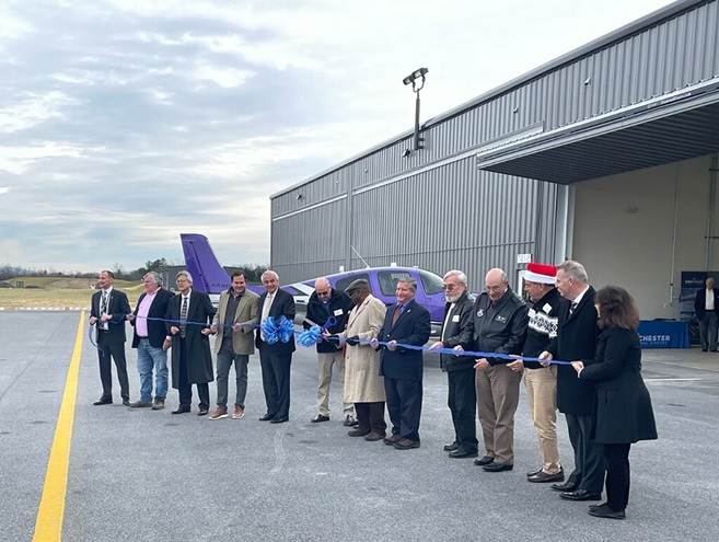 Airport, state, and local officials are joined by Adsurgo Development staff in a ribbon-cutting celebration at Winchester Regional Airport in Virginia. Photo by Paige Kroner.