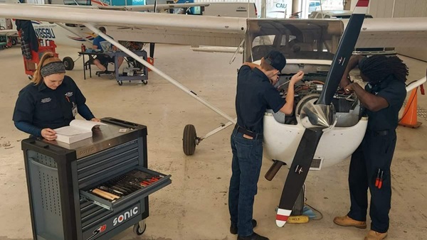 California Aeronautical University students practice their skills in the hands-on aviation maintenance technology lab. Photo courtesy of CAU.
