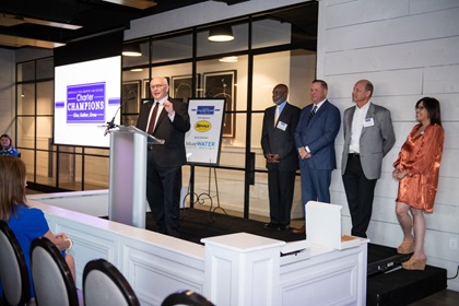 Glenn Ponas, director of the AOPA You Can Fly High School Initiative, accepts the honor of "Charter Champion" from Greenville Technical Charter High School in South Carolina during a March 30 ceremony. Photo courtesy of Amy Randall Photography.