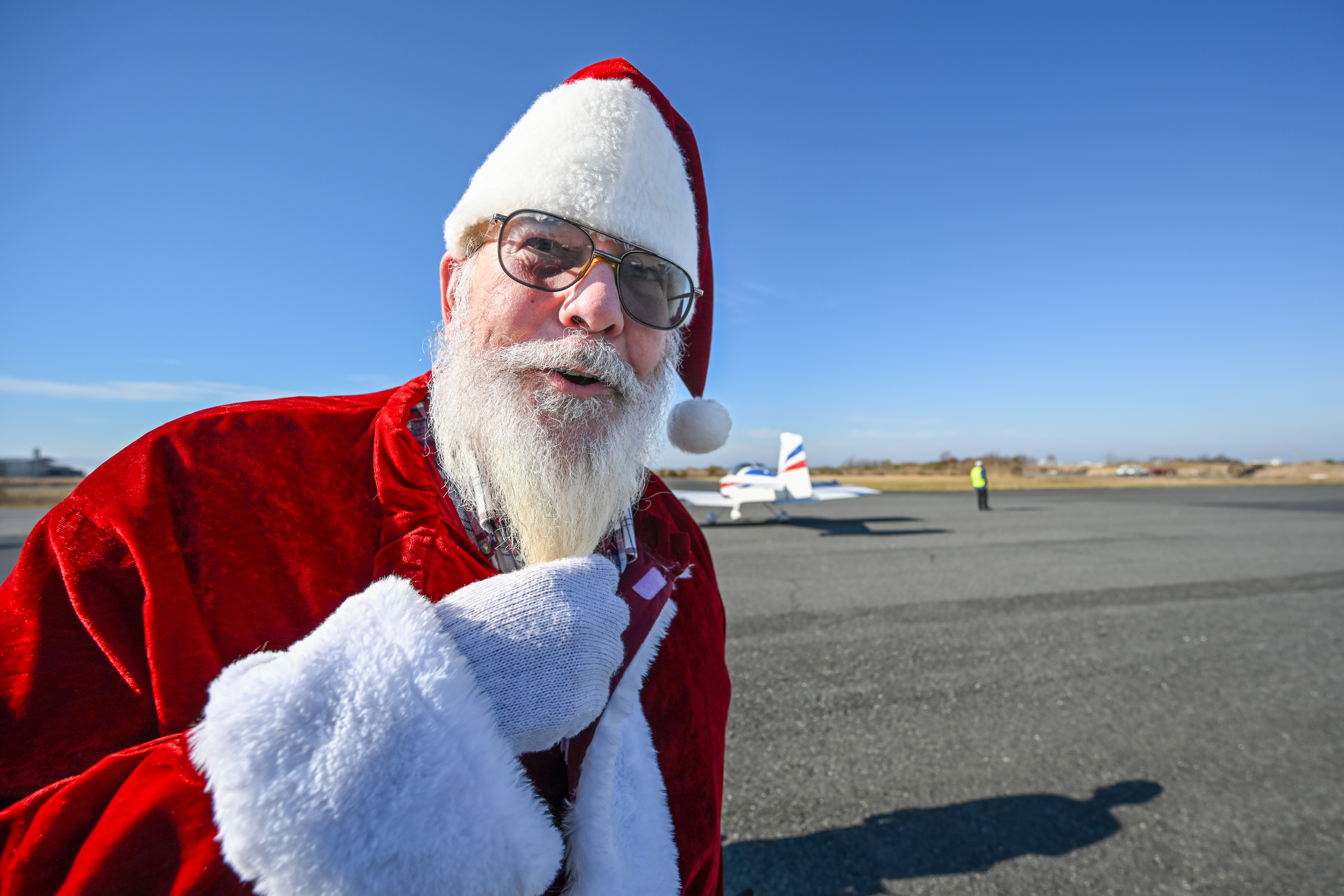Santa Claus and general aviation pilot Ralph Hoover led more than 30 aircraft and pilots to Tangier Island during the annual Holly Run. Photo by David Tulis.