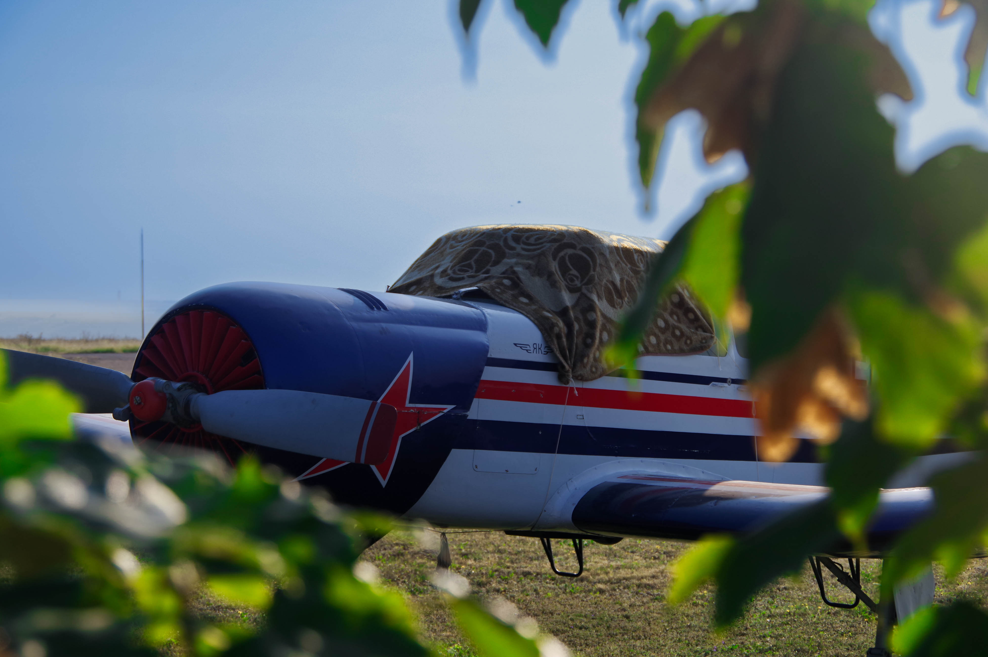 A Yakovlev Yak-18T is among the working aircraft on the field. Photo by Conner Wilson.