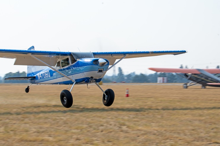 A Cessna 185E participates in a short takeoff and landing demonstration at an AOPA Fly-In in Spokane, Washington. Photo by Niki Britton.