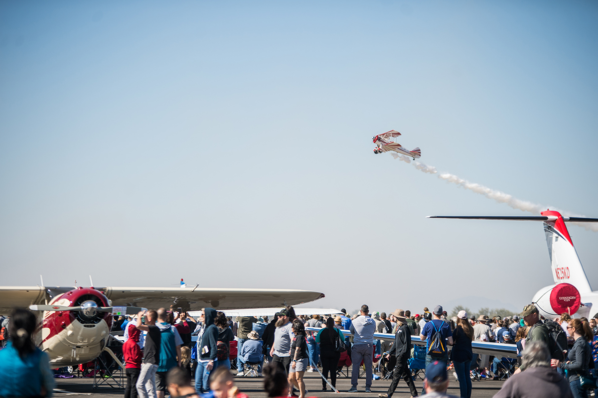 An aircraft flies over the Buckeye Air Fair crowd. Photo courtesy of the Buckeye Air Fair. 