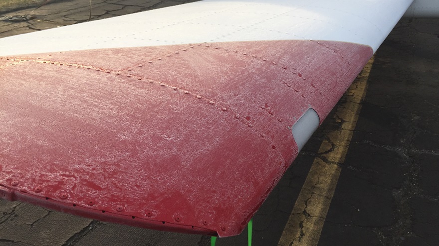 Morning frost covers the wing of a Van's RV-12. Photo by Tom Haines.