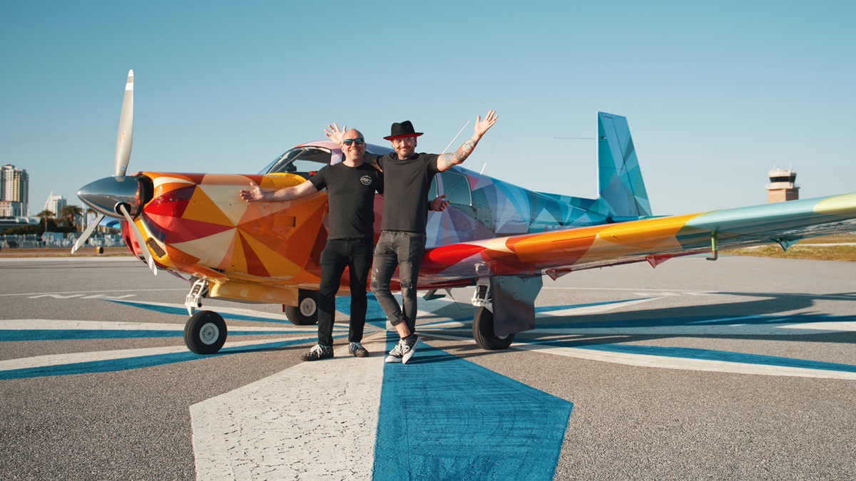 Liam Hawkins (left) and Matt Kress pose in front of the Mooney ‘Anomaly’ at Albert Whitted Airport in St. Petersburg, Florida. Photo by Collateral Beauty Films.