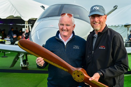 Buckeye Mayor Eric Orsborn presented AOPA President Mark Baker an award at the Buckeye Air Fair in Arizona on February 17. Photo by David Tulis.