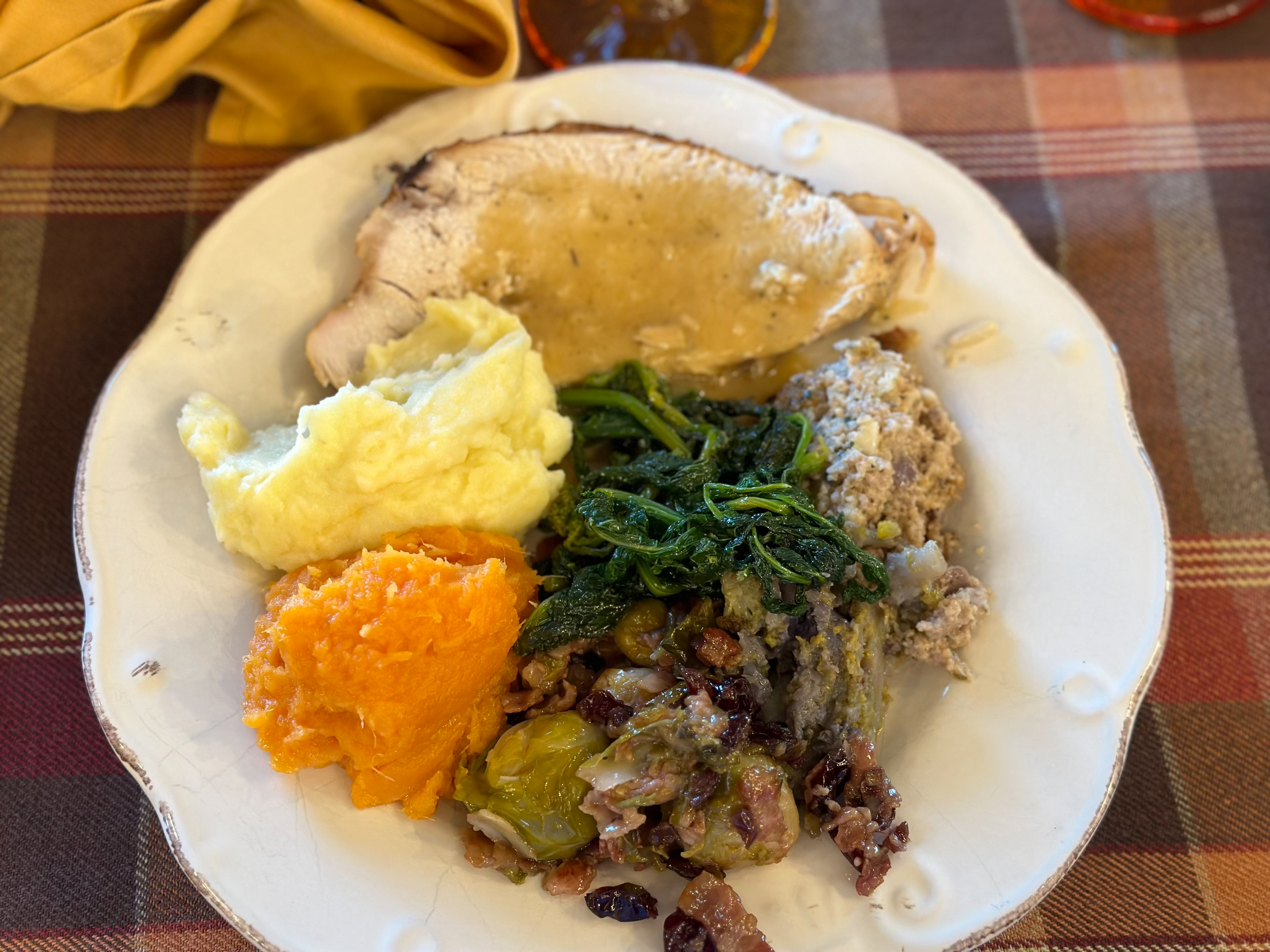 A packed Casa Gregorio 2022 Thanksgiving plate with turkey, white potatoes, sweet potatoes, Italian greens, Brussels sprouts, and the Aulensi family traditional stuffing. Photo by Mary Michael.