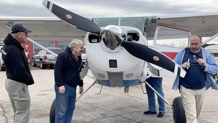 Scott Clark, Dave Stoots, and Gary Ramsey conduct a thorough post flight walkaround. The flight was free of squawks. Photo by Cayla McLeod Hunt.