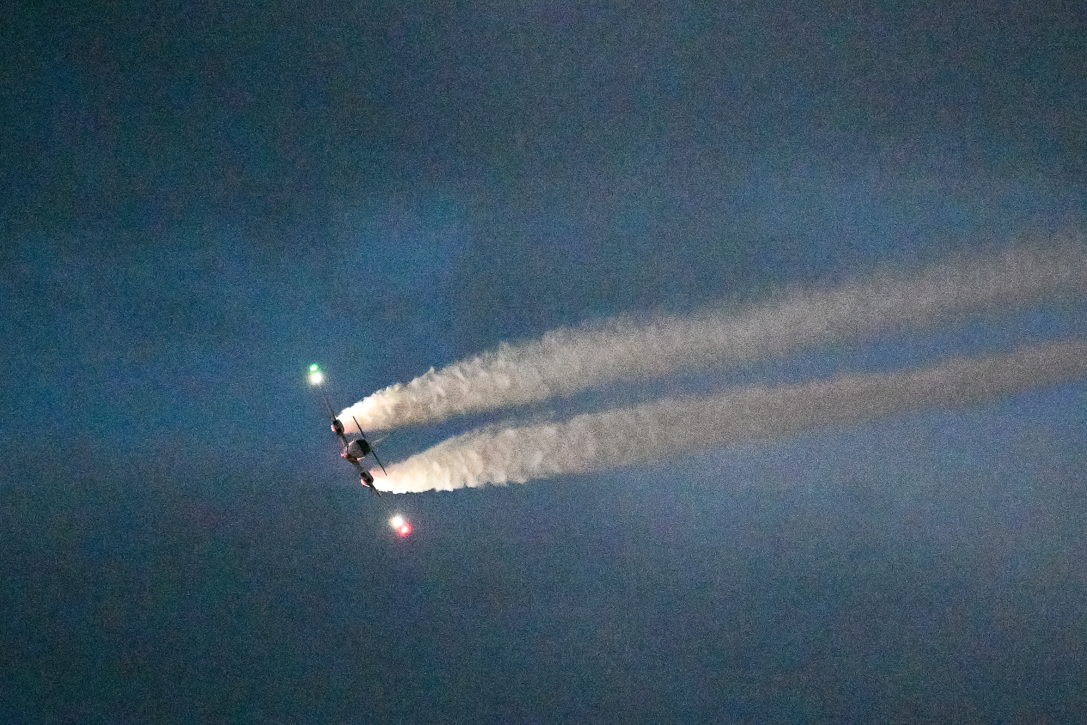 David Martin performs in a Beechcraft BE-55 during the Saturday night airshow. Photo by David Tulis.