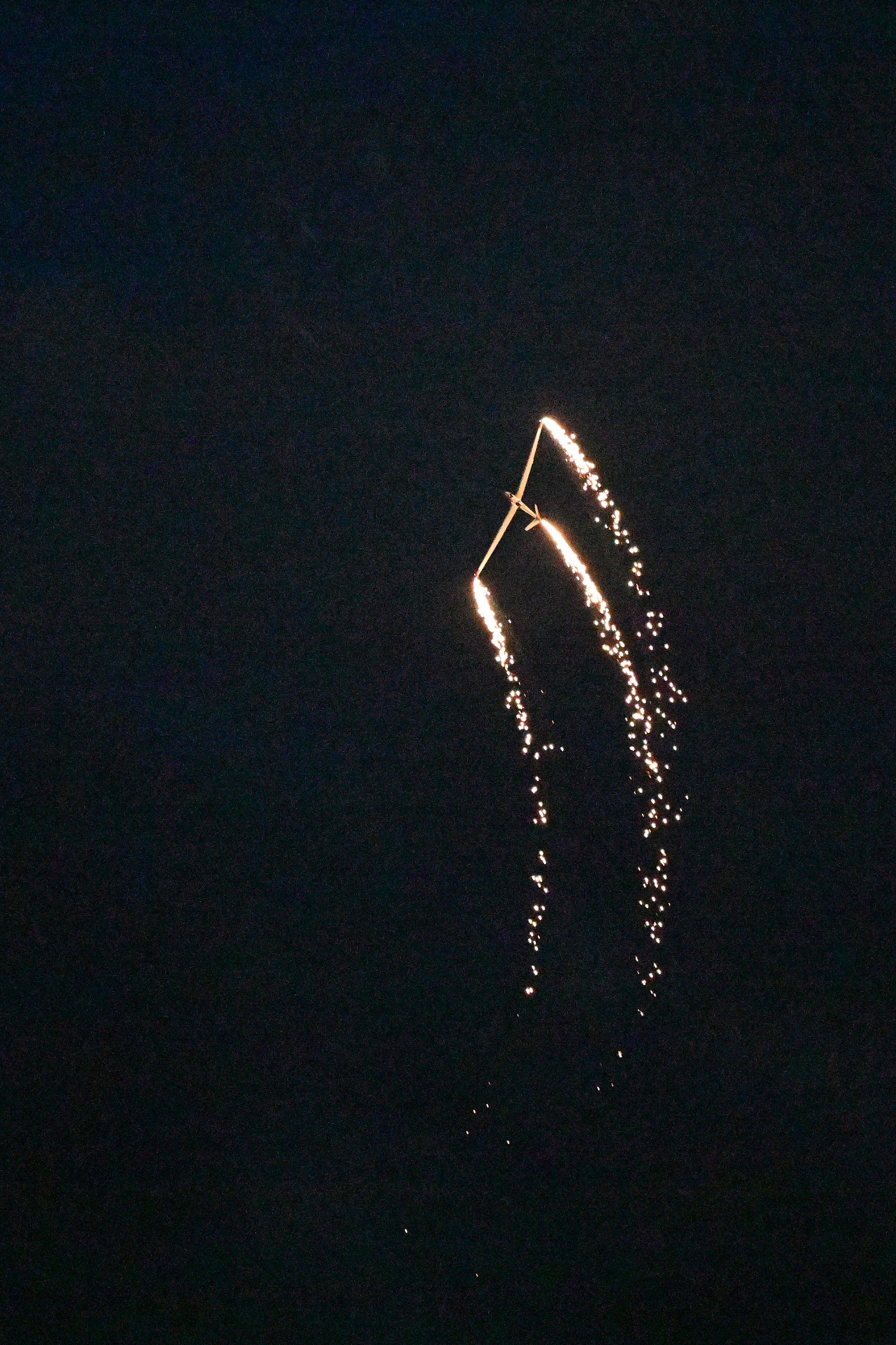 Bob Carlton performs in a Super Salto during the Saturday night airshow. Photo by David Tulis.