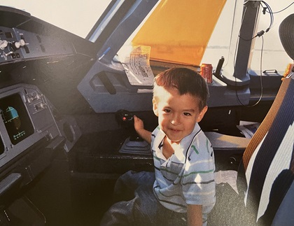 Justin Duval at five years old exploring the cockpit of an Airbus A320 on his first commercial airline flight. Photo courtesy of Justin Duval.