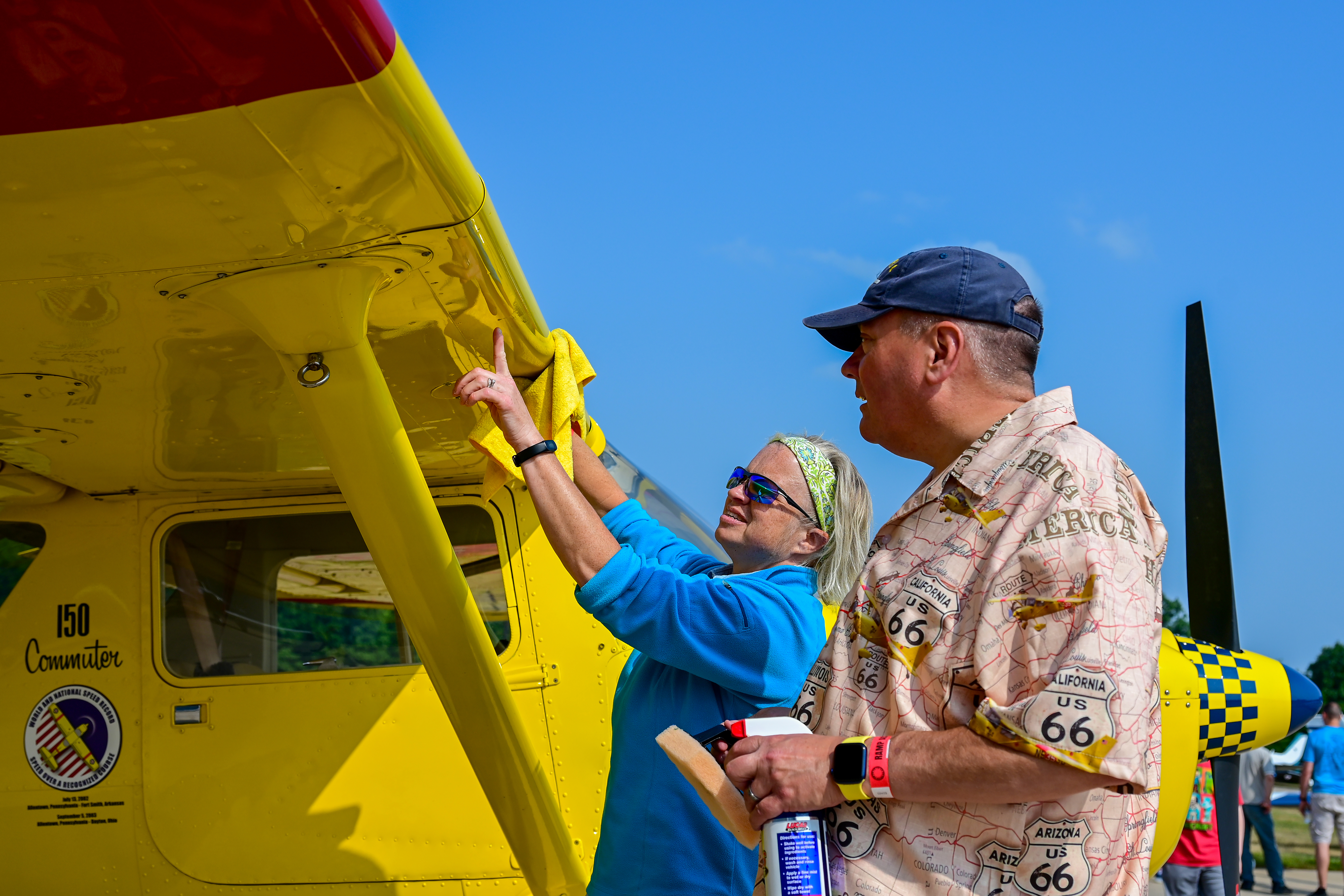 Melissa Kelley and Edward Figuli of Pennsylvania clean their Cessna 150 Commuter before hundreds of children and their parents descend on the Smithsonian National Air and Space Museum’s Steven Udvar-Hazy Center to learn about aviation. Photo by David Tulis.