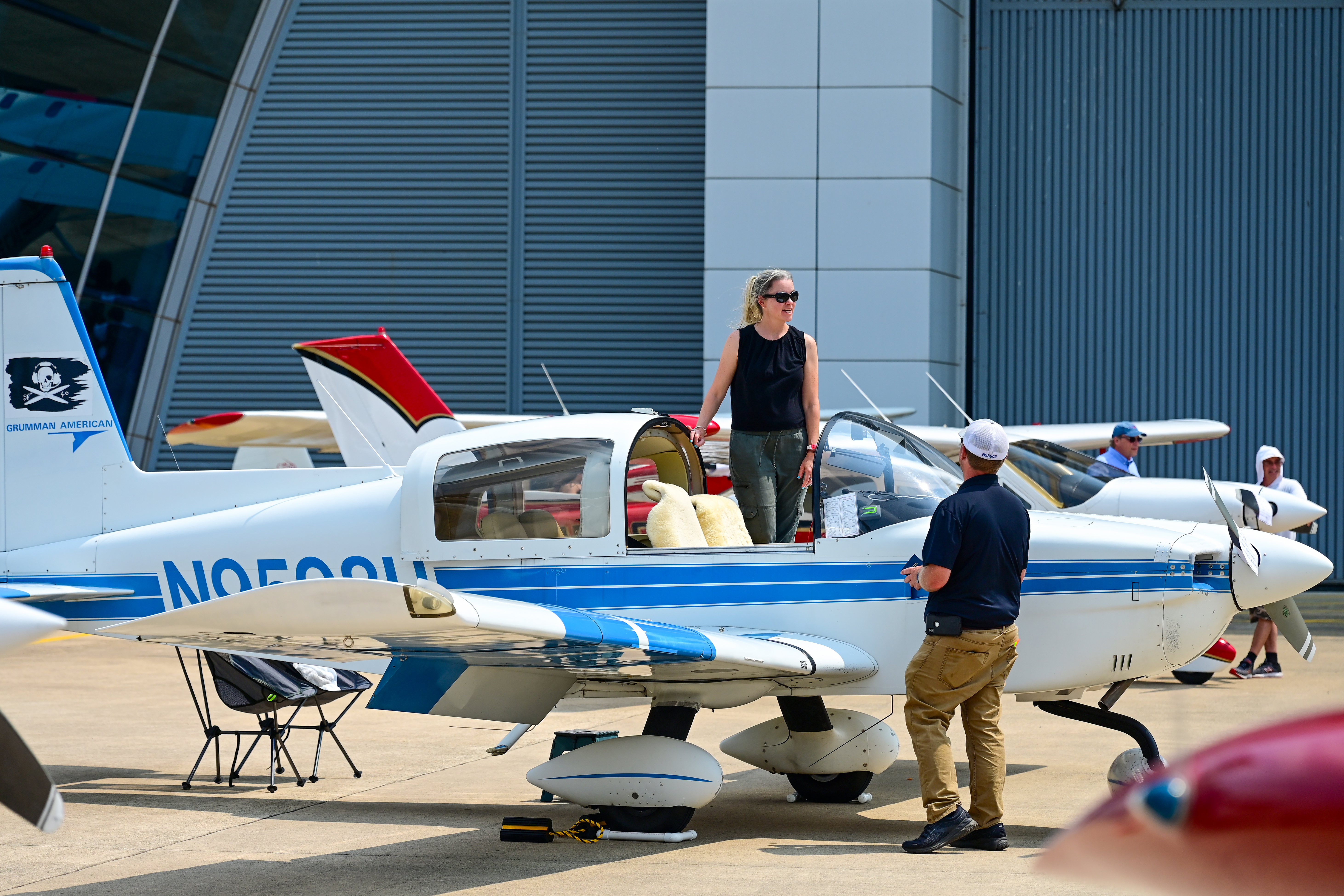 Woman Airforce Service Pilots advocate, author, and private pilot Erin Miller was happy to tell visitors to the Smithsonian National Air and Space Museum's Innovation in Flight Day that she is indeed the pilot of this Grumman AA-5A Cheetah. Miller earned her certificate in 2023 and is the granddaughter of Elaine Danforth Harmon, a member of the Women Airforce Service Pilots during World War II. Photo by David Tulis.