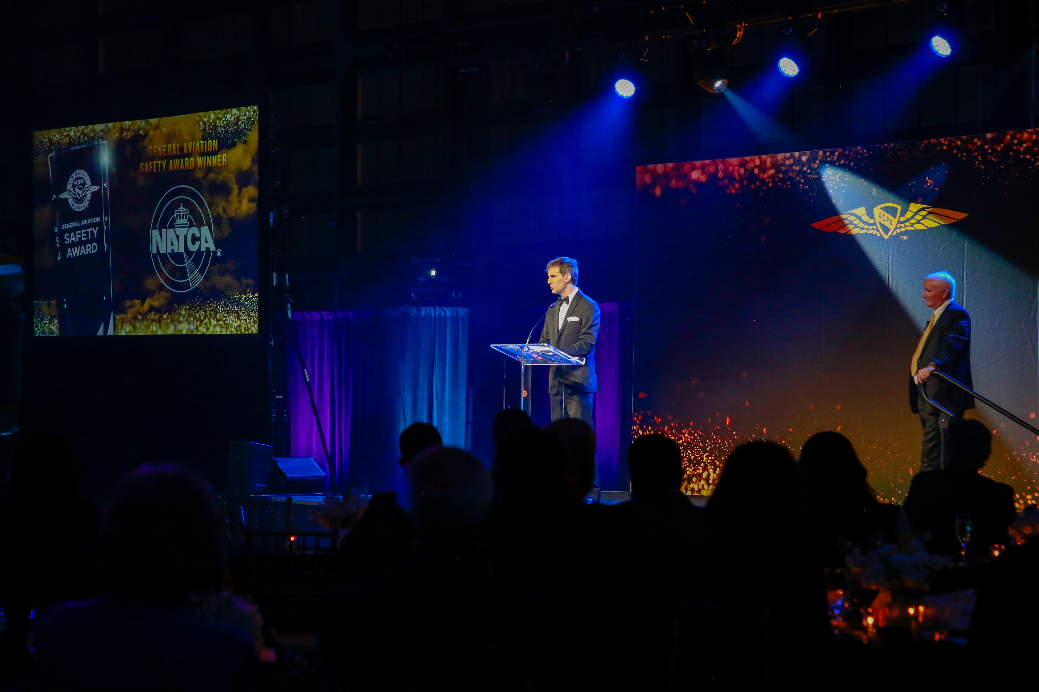 National Air Traffic Controllers Association President Rich Santa accepts the General Aviation Safety Award. Photo by Rebecca Boone.