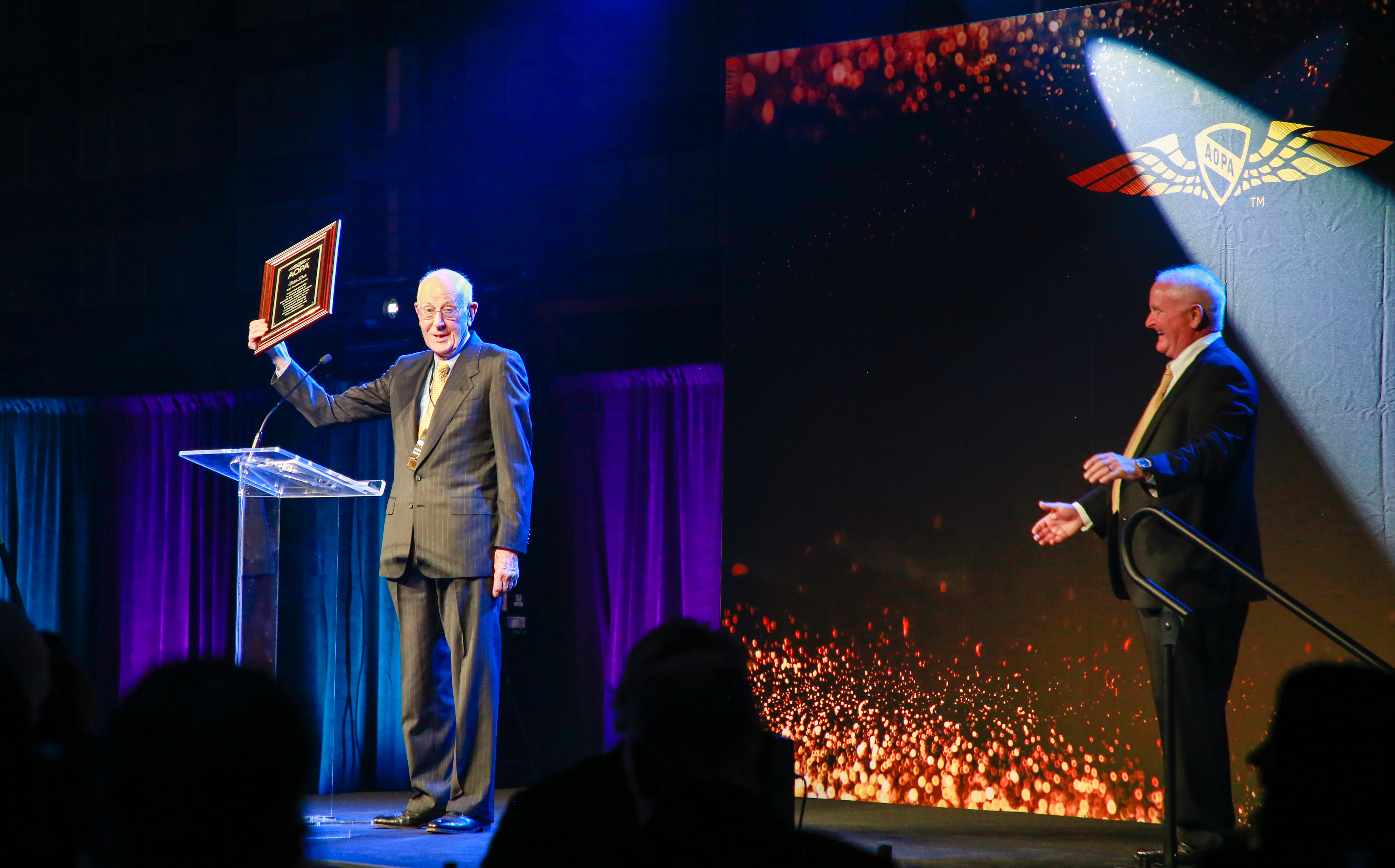 Mike Dale of Culpeper Regional Airport in Virginia accepts the Sharples Award from AOPA President Mark Baker. Photo by Rebecca Boone.