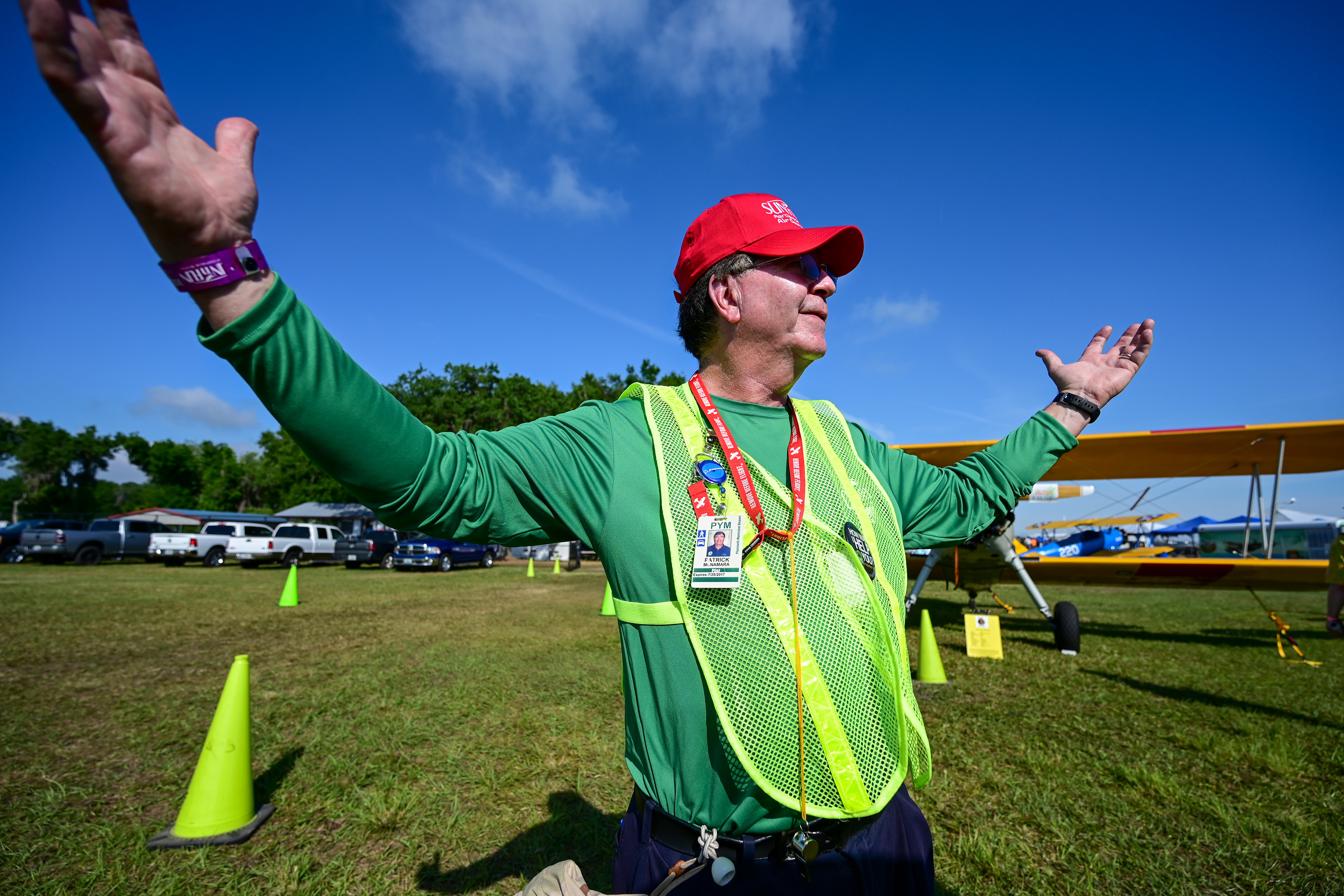 Volunteer Patrick McNamara of Plymouth Municipal Airport in Massachusetts walks the vintage aircraft flight line during the Sun 'n Fun Aerospace Expo.  Photo by David Tulis.