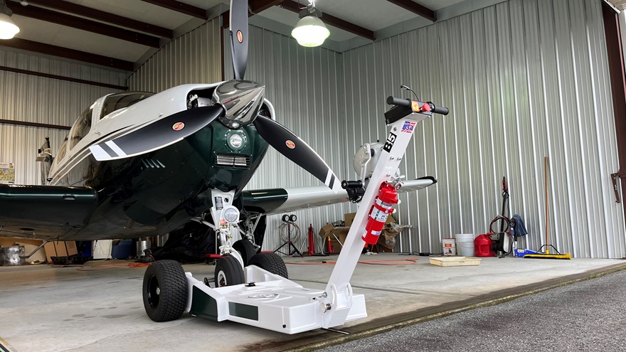 A 2.5-pound halon extinguisher mounted to the aircraft tug keeps it close to the engine and fuel source. Photo courtesy of Jeff Simon.