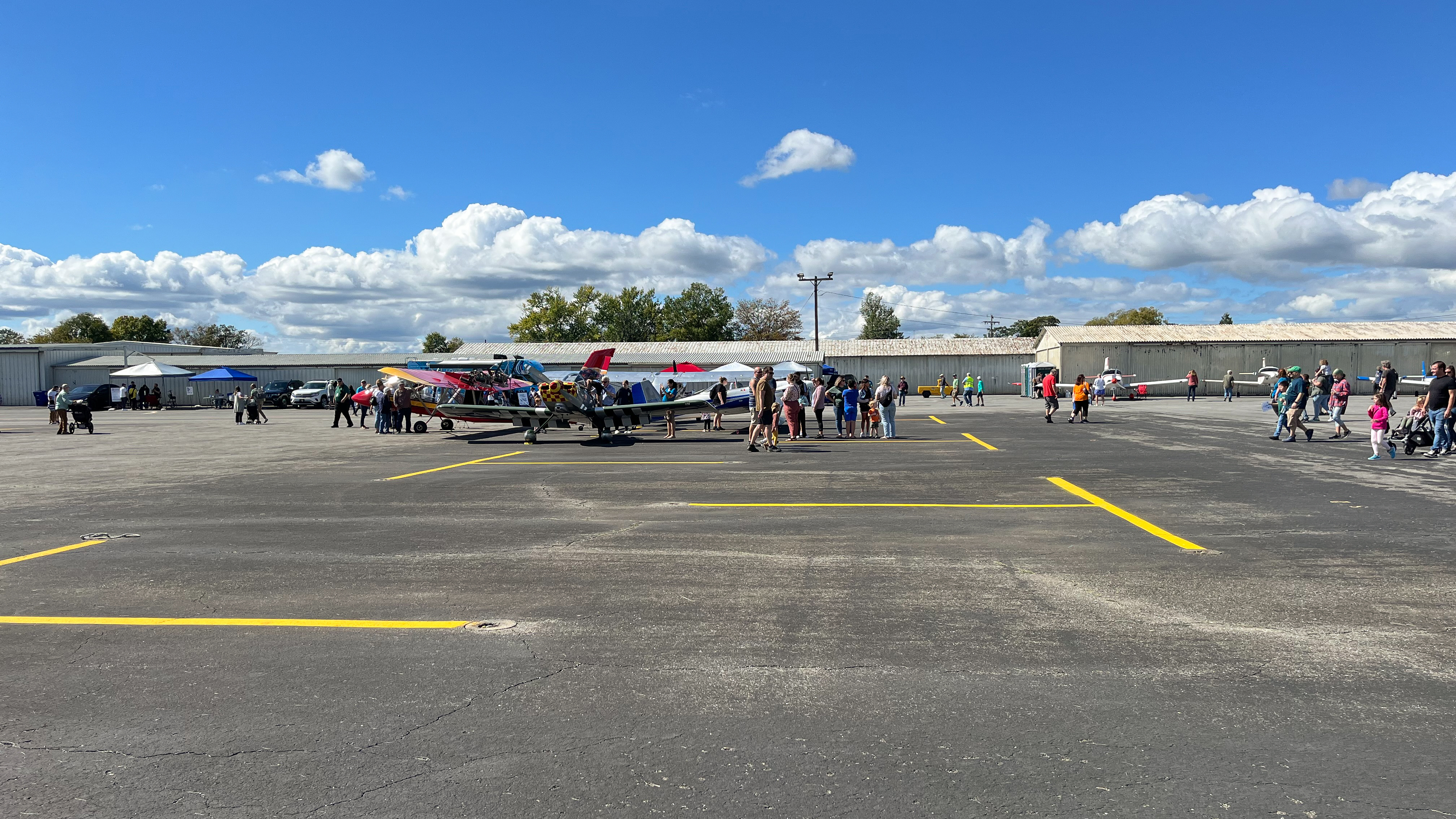 Visitors leisurely walk around the aircraft exhibited at the event. Photo by Sylvia Horne.