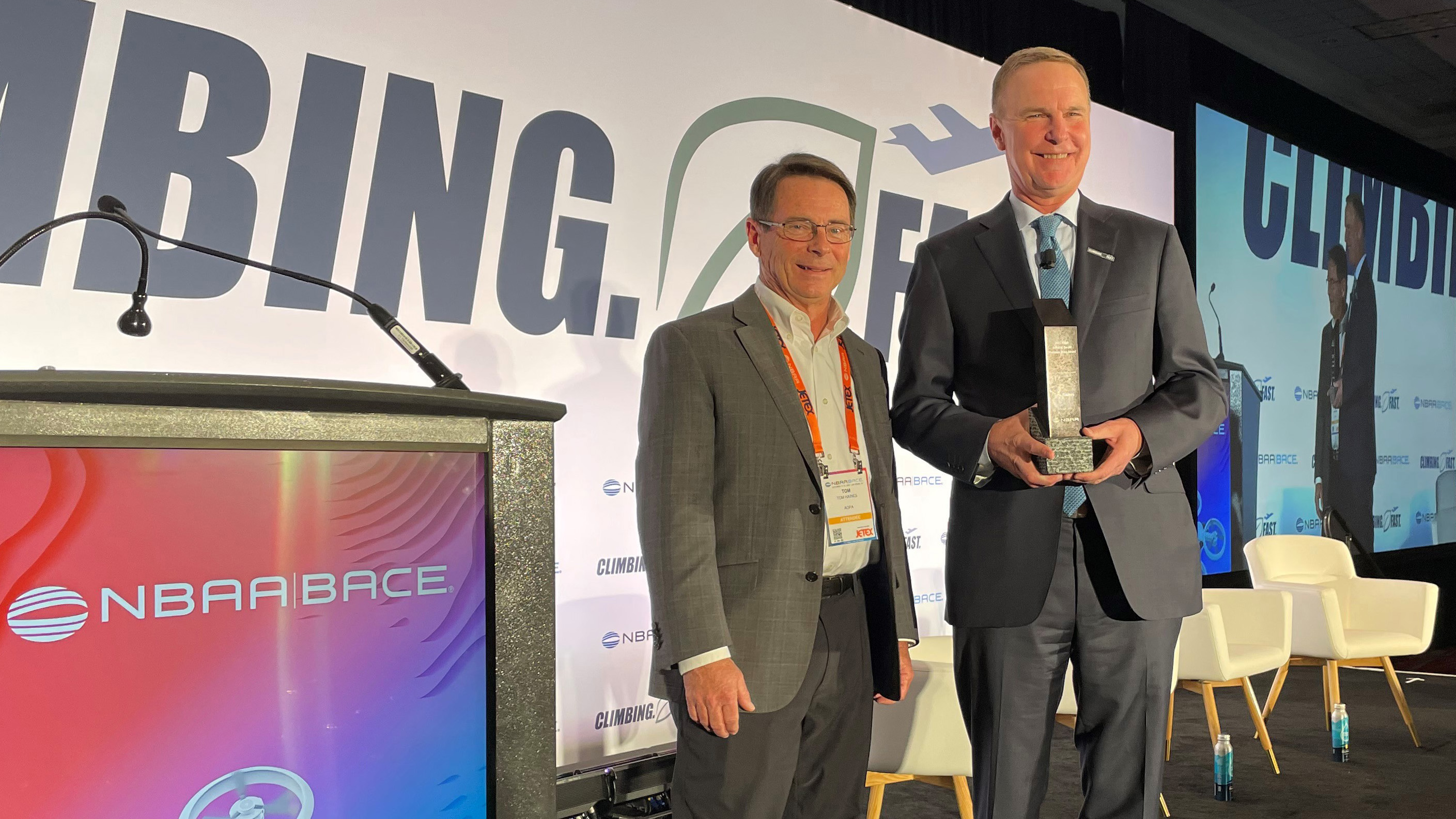 National Business Aviation Association President and CEO Ed Bolen presented the David W. Ewald Platinum Wing Award to longtime AOPA editor in chief Tom Haines on October 17. Photo by Kollin Stagnito.