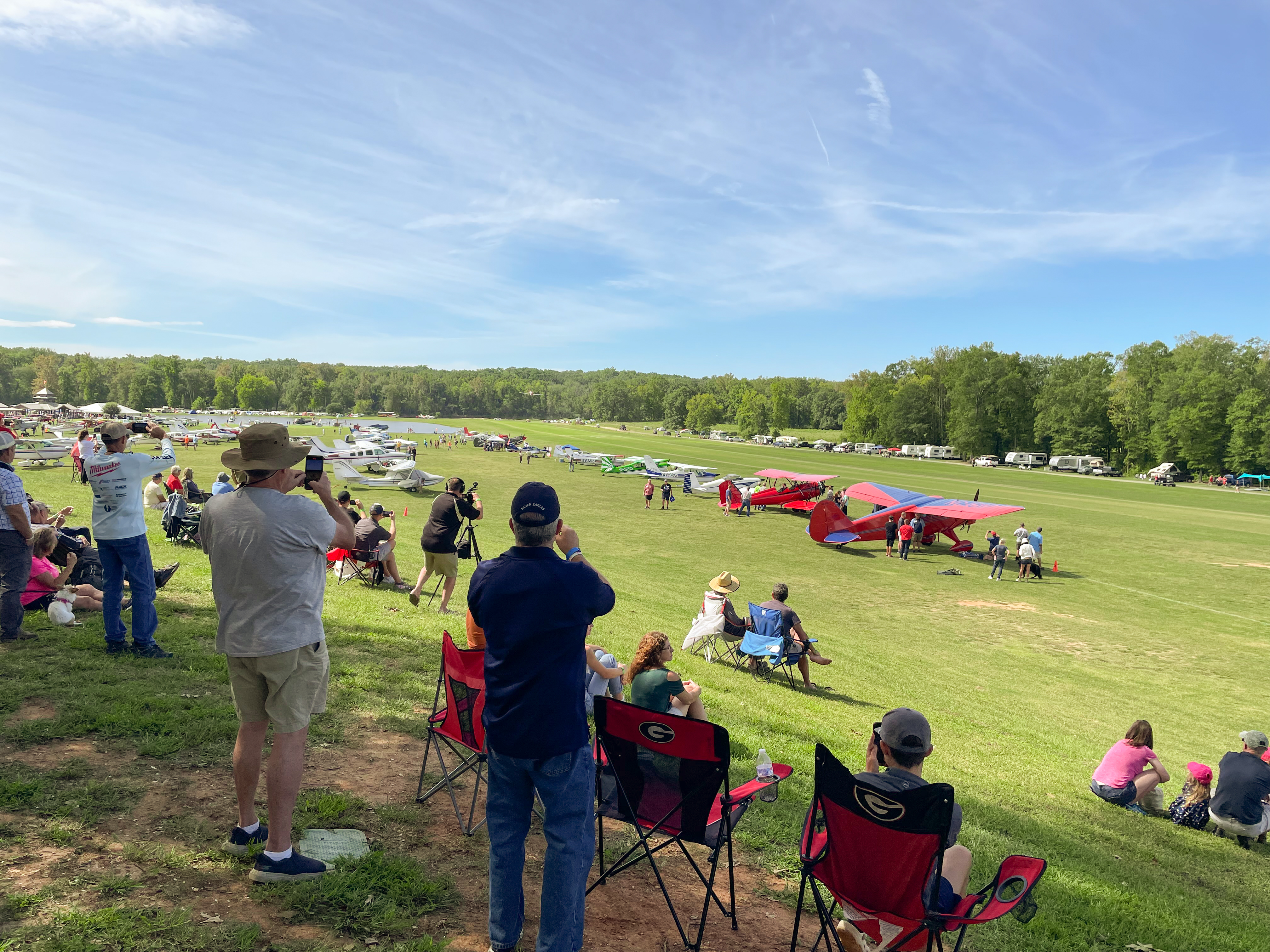 Triple Tree Fly-In attendees flock to the ultimate viewing area under the World War II-era control tower. This hilltop perch affords the best views of the many takeoffs, landings, and flybys during the fly-in. Photo by Kollin Stagnito.