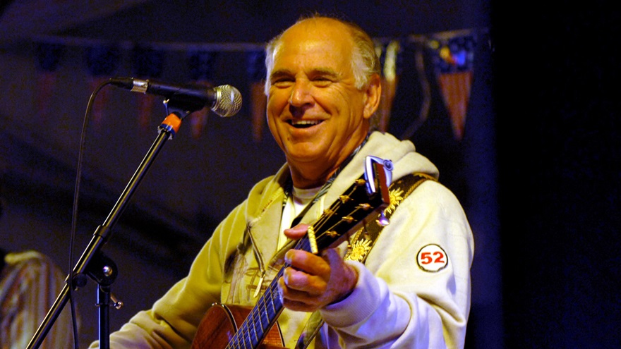 Jimmy Buffett photographed in 2008 performing a USO concert for the crew of the USS Harry S. Truman. U.S. Navy photo by Chief Mass Communication Specialist Michael W. Pendergrass.