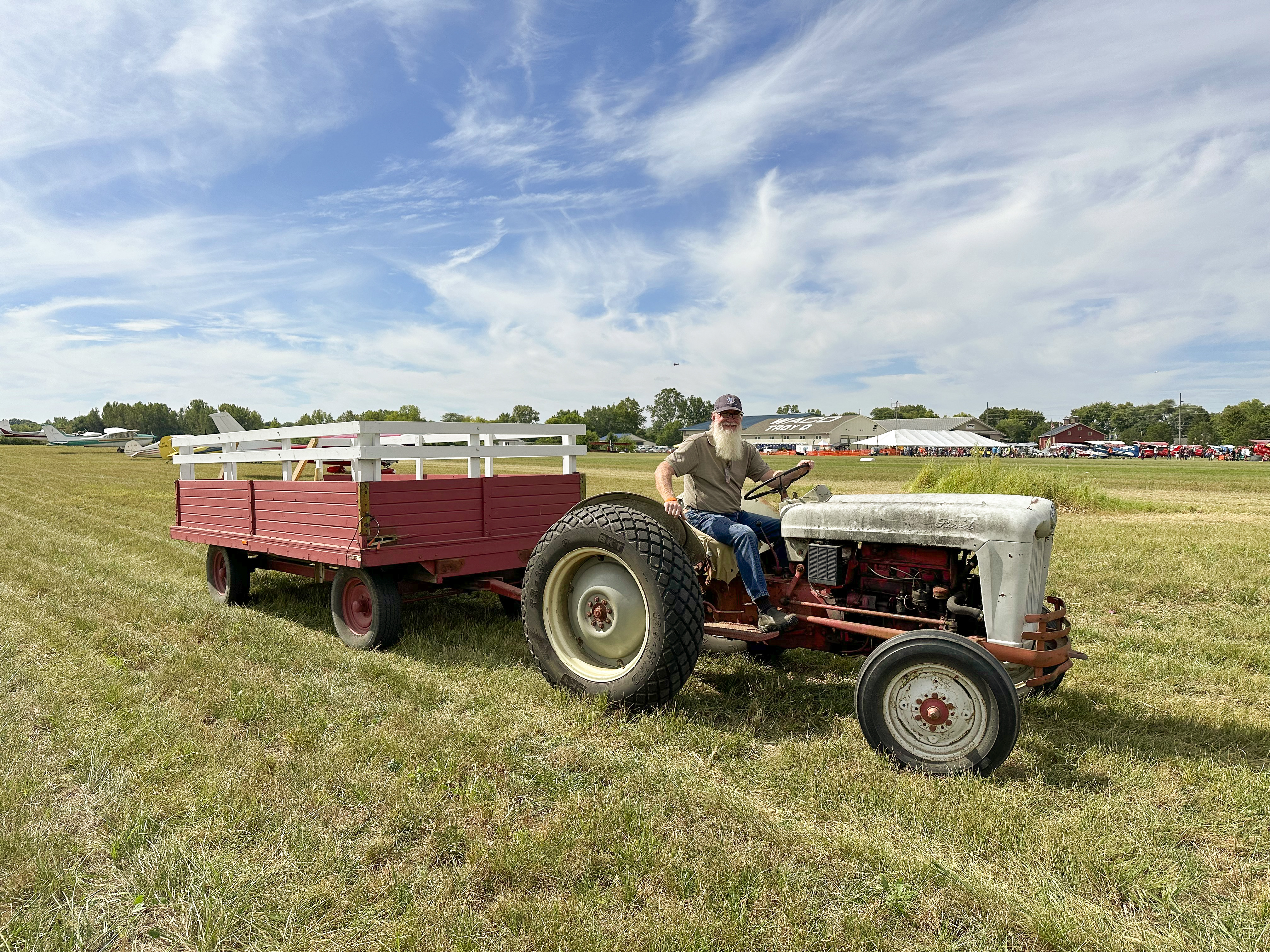 General aviation attendees could catch a shuttle—an old, rusted silver Ford tractor pulling a wagon—across Waco Field to the Waco Air Museum's 100th anniversary celebration fly-in. Photo by Alyssa J. Cobb.