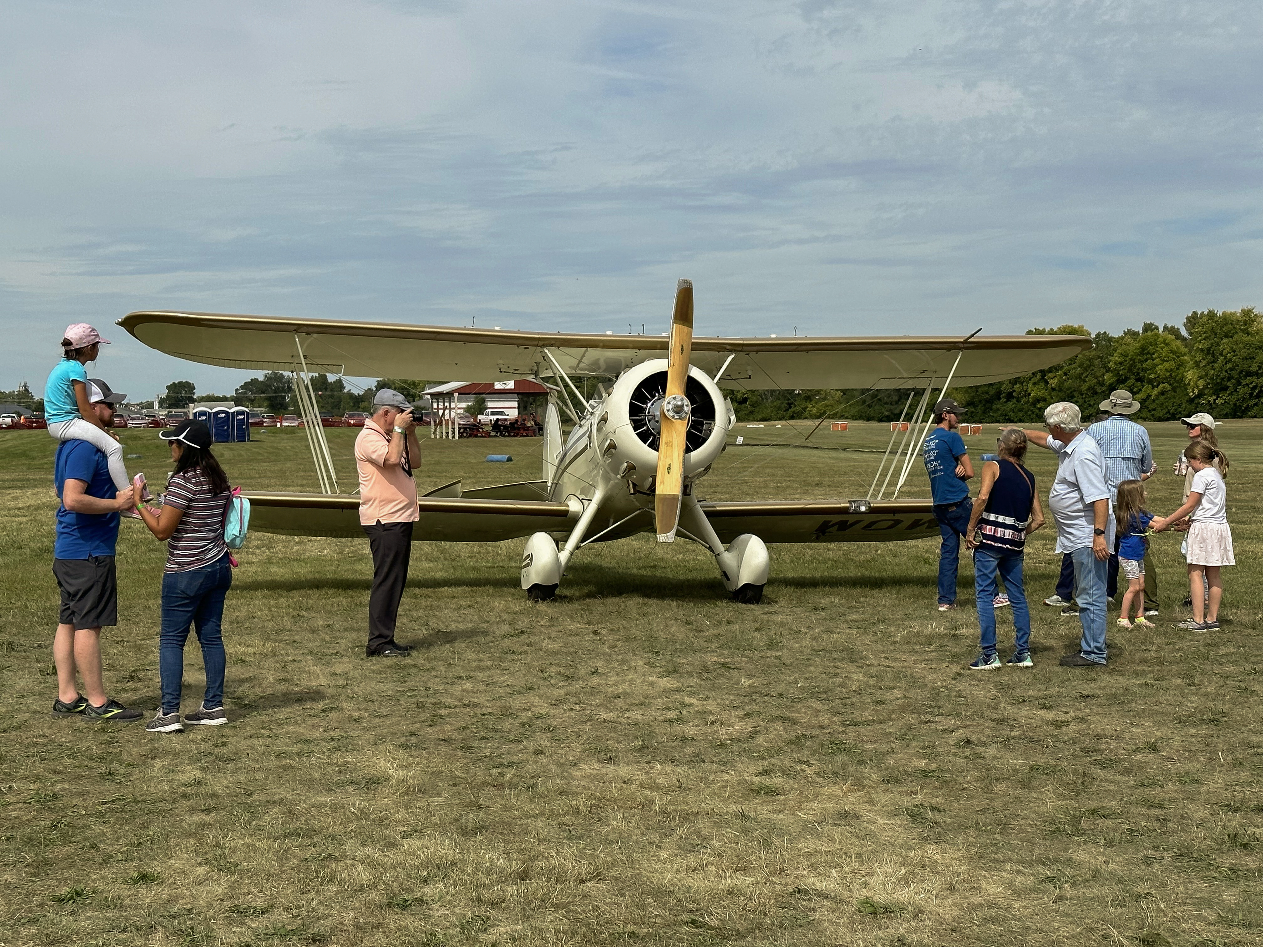 Young and young at heart alike are drawn to the sleek lines of a Waco. Photo by Alyssa J. Cobb.