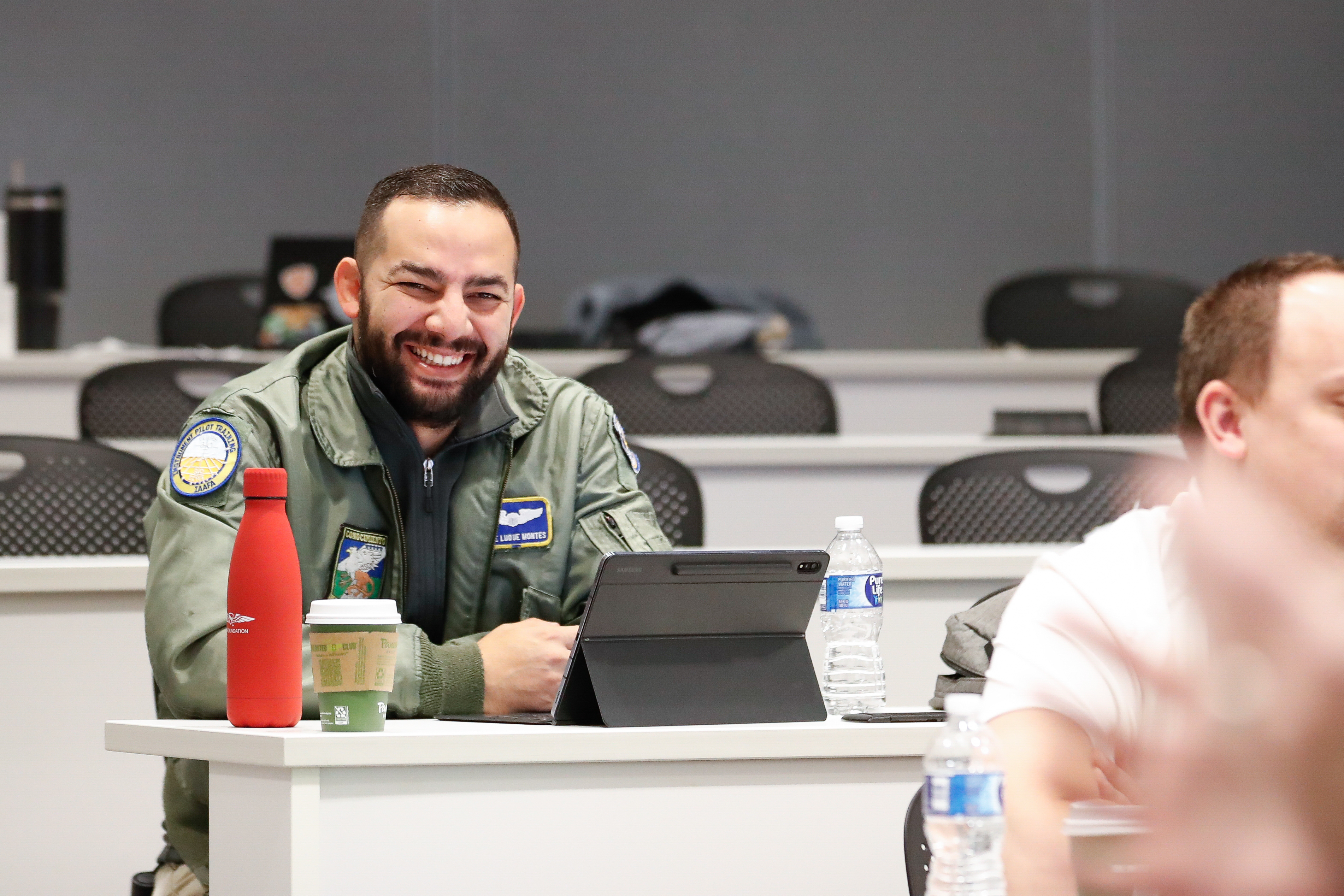 High school educator Jaime Luque laughs during a lecture. Photo by Rebecca Boone.