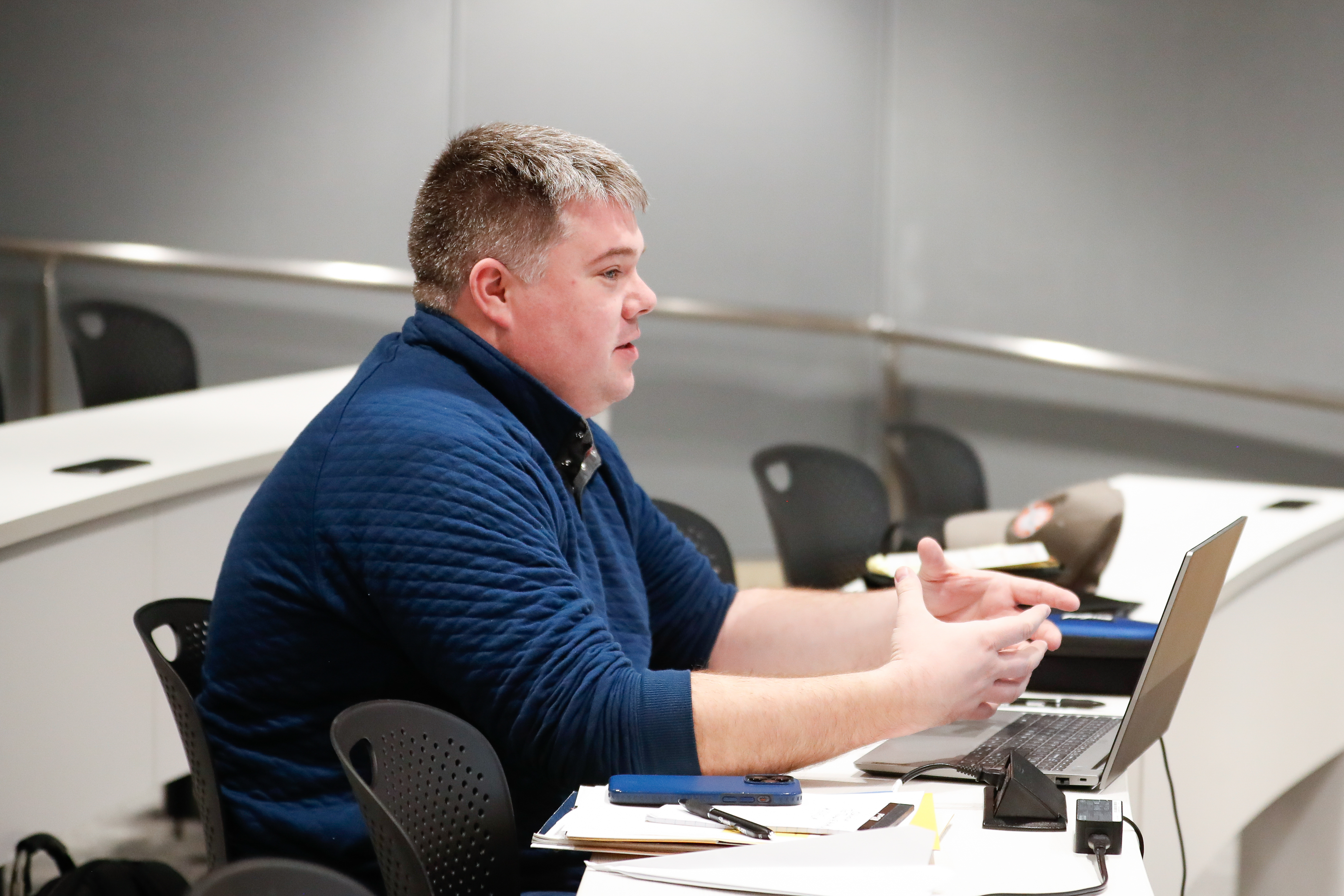 High school educator Thomas Sando asks a question during a lecture. Photo by Rebecca Boone.