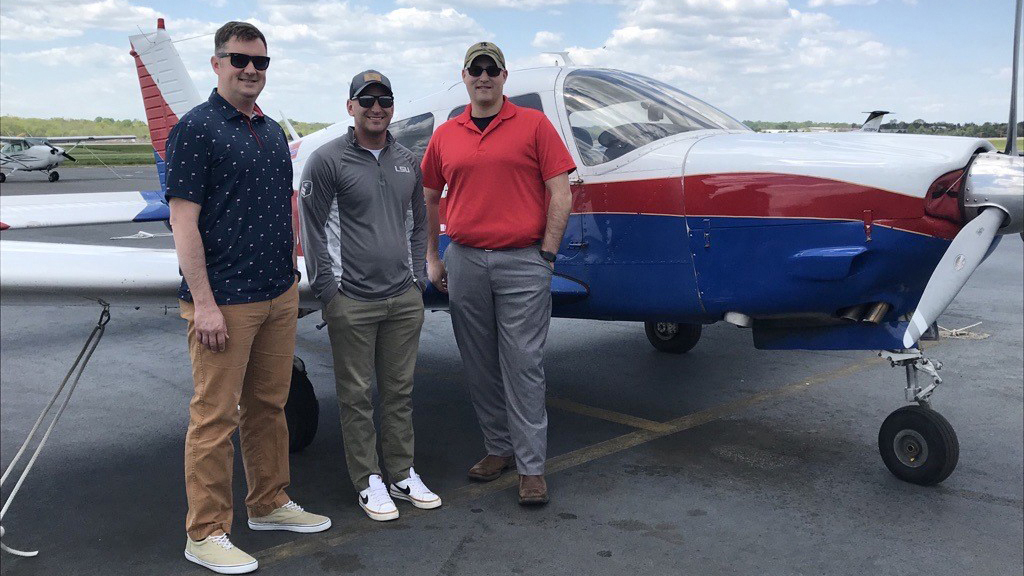 Louisiana National Guard members (left to right) Capt. Stephen Gancarcik, Sgt. 1st Class Joey Airhart, and Sgt. Brandon Sevin have been using their off-duty time and Army benefits to earn pilot certificates and ratings while on a long-term deployment. They are flying with Aviation Adventures in Manassas, Virginia. Photo by Jill Tallman.