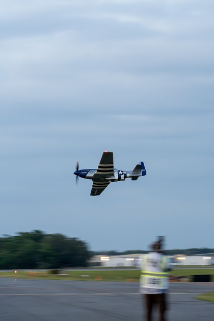 Lee Lauderback flies 'Crazy Horse 2' past the admiring crowd at the night airshow on April 10. Click image to view a slideshow from the night airshow. Photo by Brianna Cabassa.