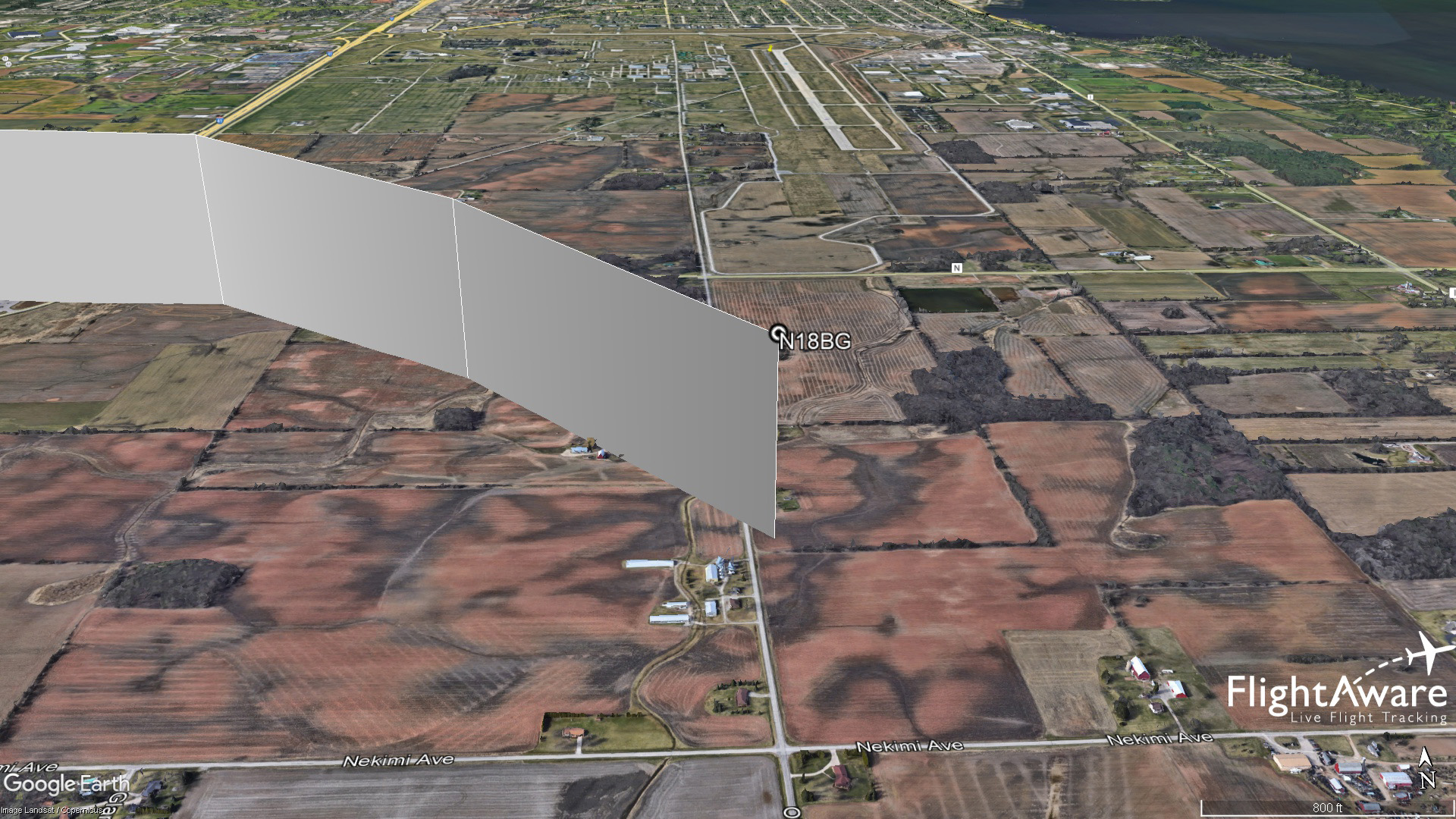 ADS-B returns recorded by FlightAware are overlaid on this Google Earth image showing the track of a Lancair ES aircraft that approached Wittman Regional Airport in Oshkosh, Wisconsin, on July 22, before turning away from the airport and crashing in a farm field about 1.5 nautical miles south of the Runway 36 threshold.