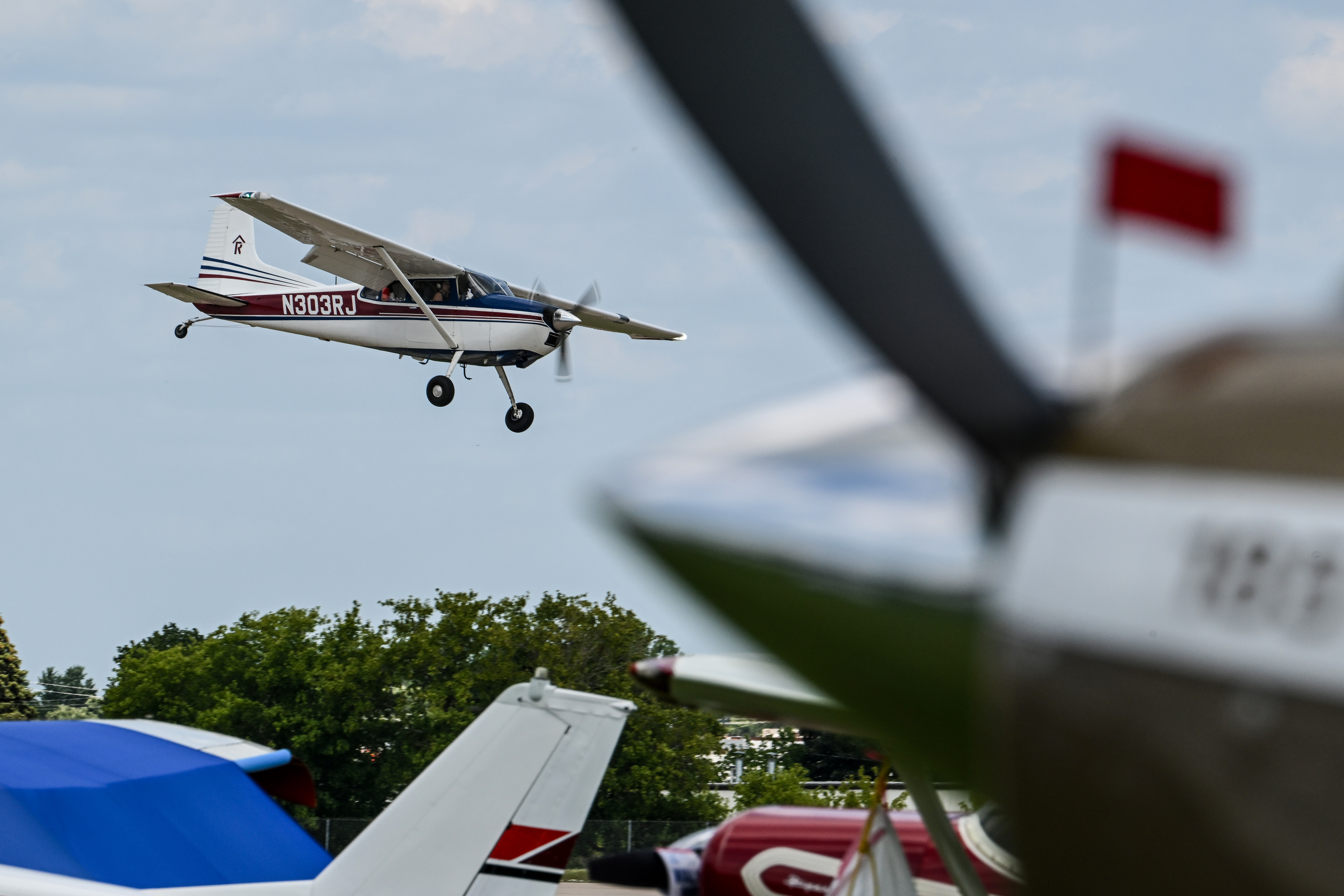 A Cessna 185 arrives. Photo by David Tulis.