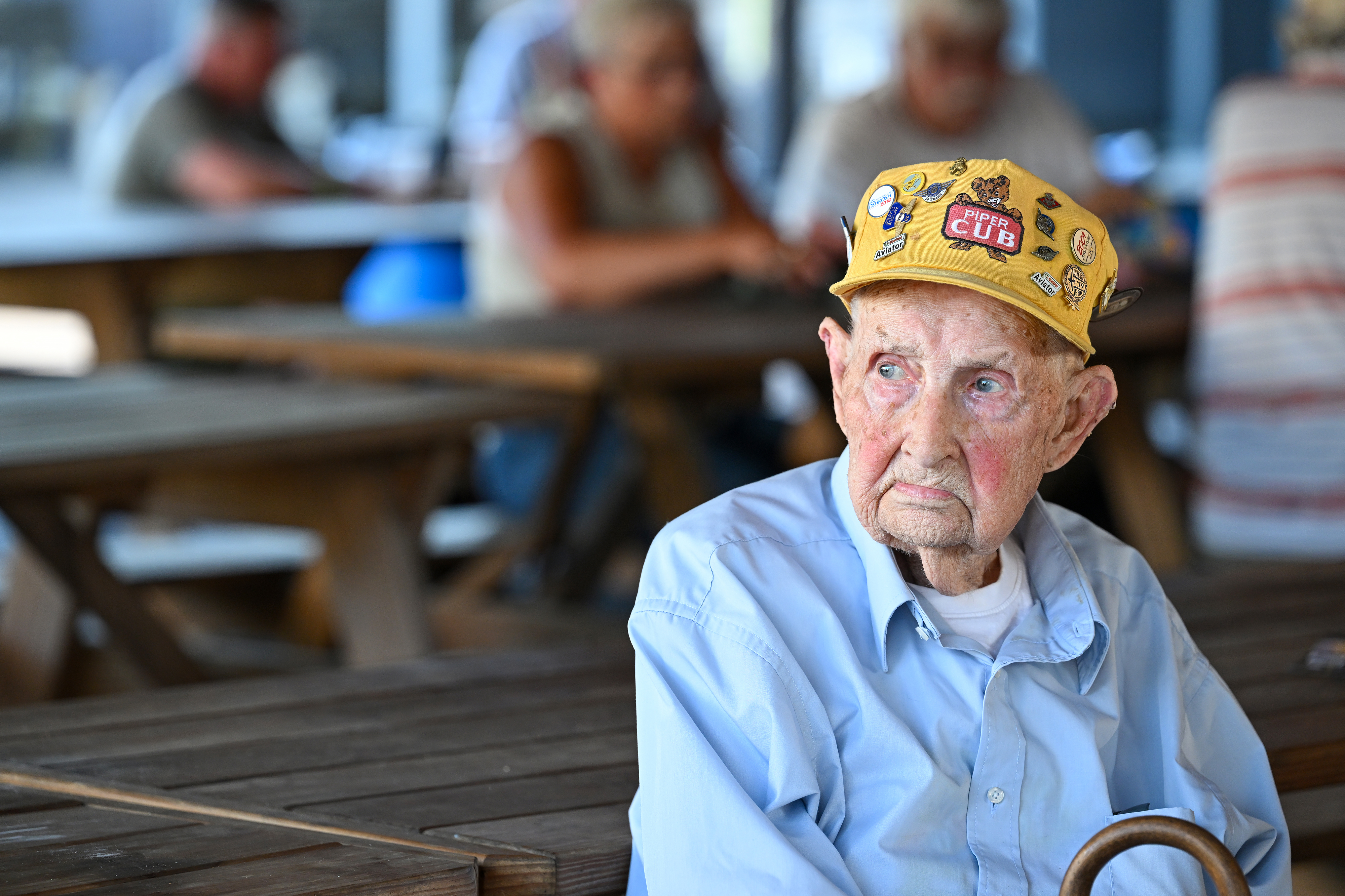 Pilot and former Piper Cub owner Robert Peterson of Mahaffey, Pennsylvania, worked at the Piper Lock Haven assembly plant during the 1940s and shared his 100th birthday celebration with fellow pilots during this year’s thirty-eighth Sentimental Journey Fly-In. Photo by David Tulis.