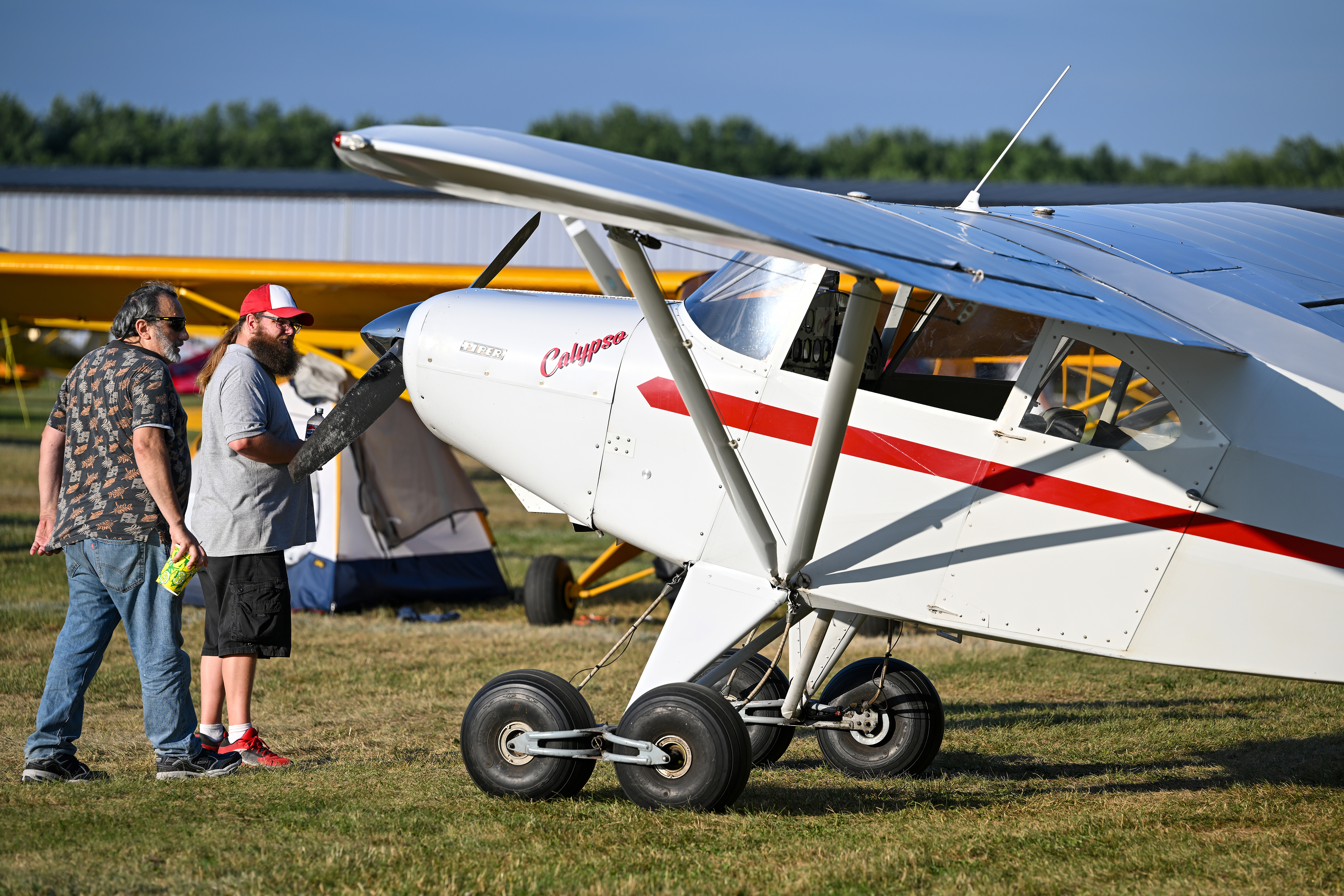 Ben Presten’s Piper PA-16 Clipper 'Calypso' outfitted with Whittaker rough-field landing gear draws curious glances. The tandem dual-wheel landing gear helps smooth out rough airfields and was an option on some early Piper high-wing models. Low-pressure, large-diameter bush tires later replaced the innovative approach to backcountry landing gear. Photo by David Tulis.