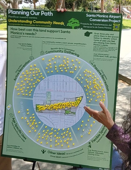 At a recent community engagement meeting, residents were encouraged to place a pin to indicate how they would like to see the land best used. Many community attendees placed their pin on the runway, expressing desire to keep the Santa Monica Municipal Airport. Photo by Jared Yoshiki.