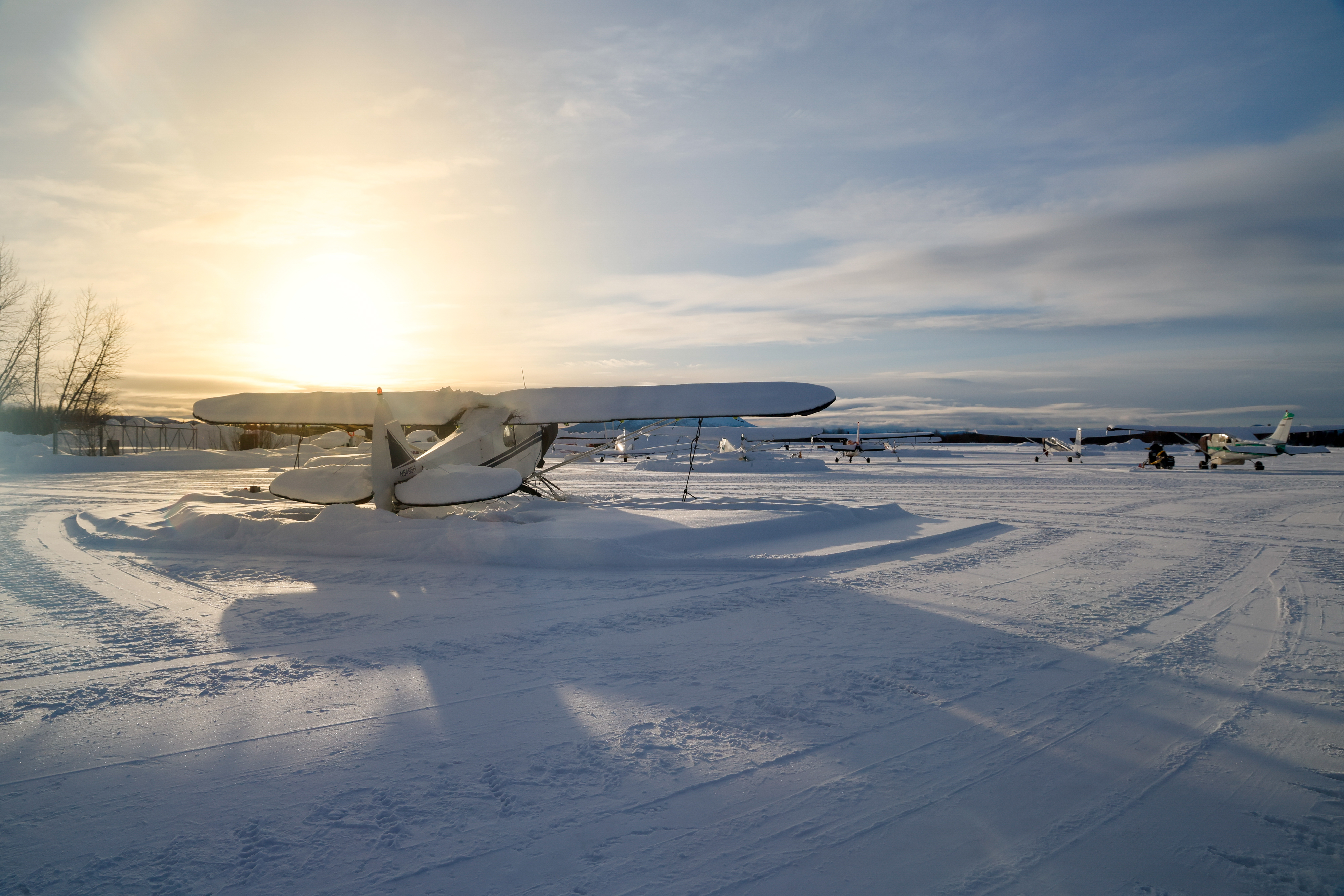 The sun shines on locally based aircraft parked on the ramp at McGrath Airport March 5. Photo by Chris Rose.