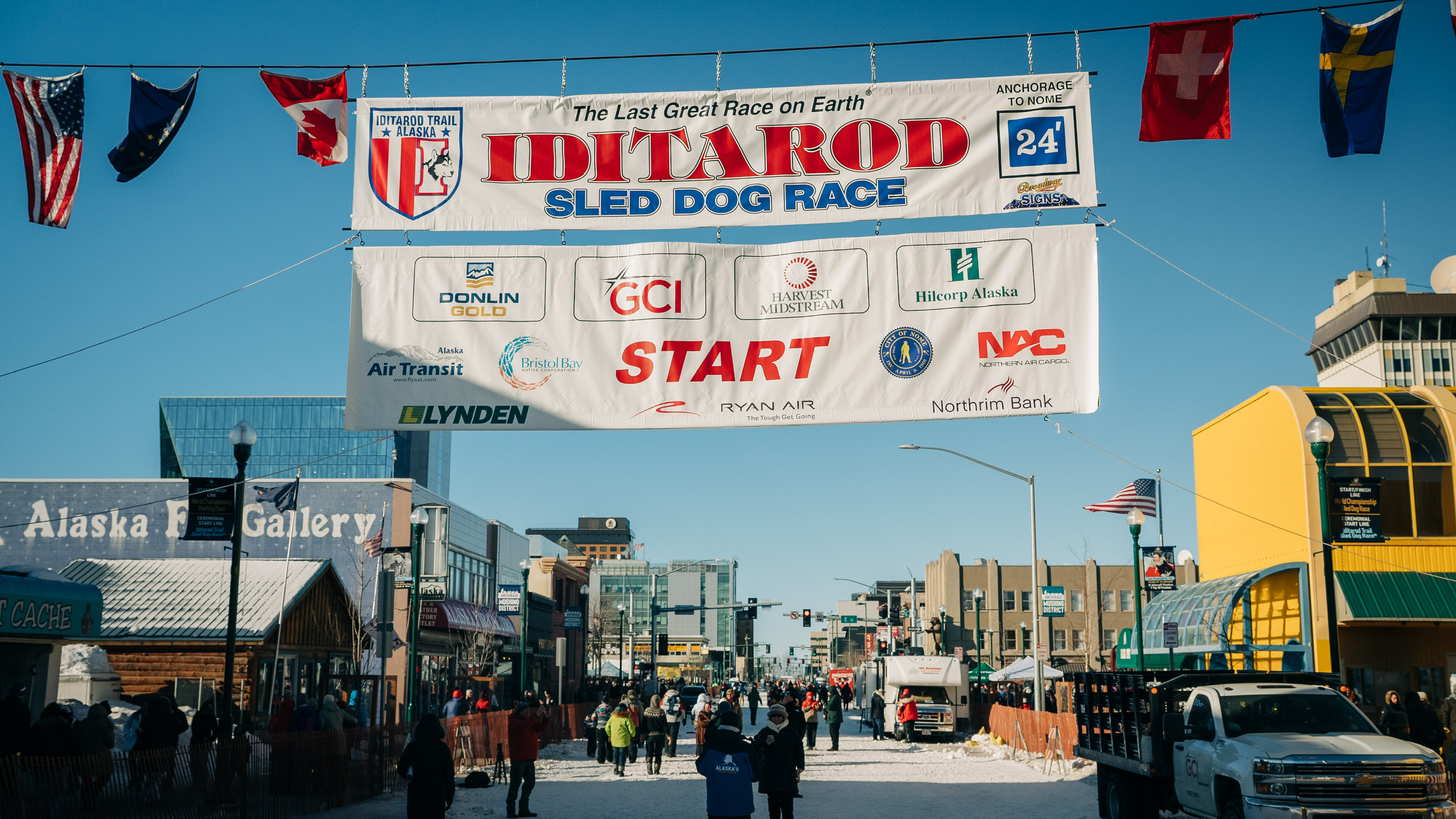Spectators disperse after the last teams pull out of town. Photo by Jamal Warner.