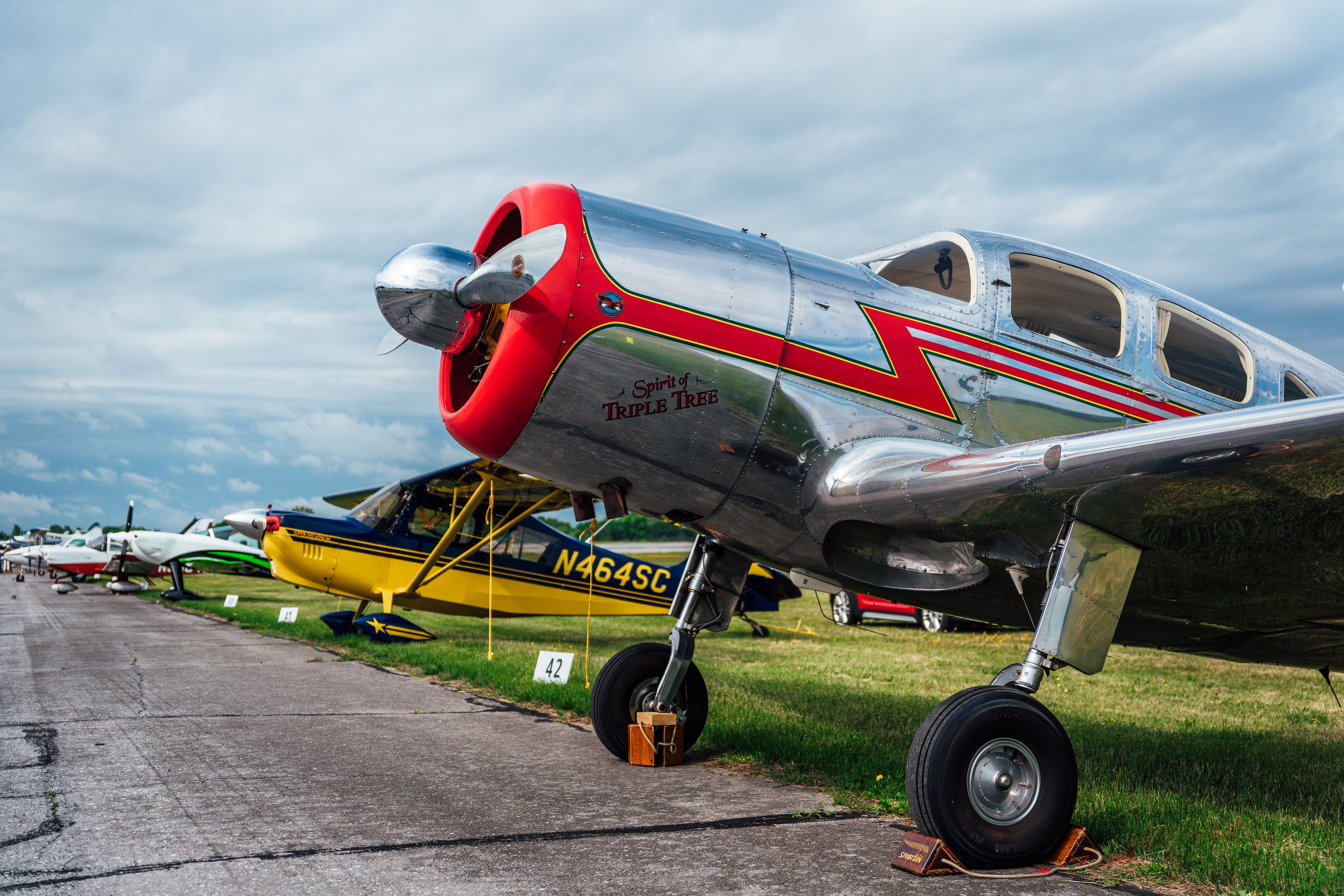 Parade aircraft await the event under less favorable weather May 9. Photo by Jake Teague.