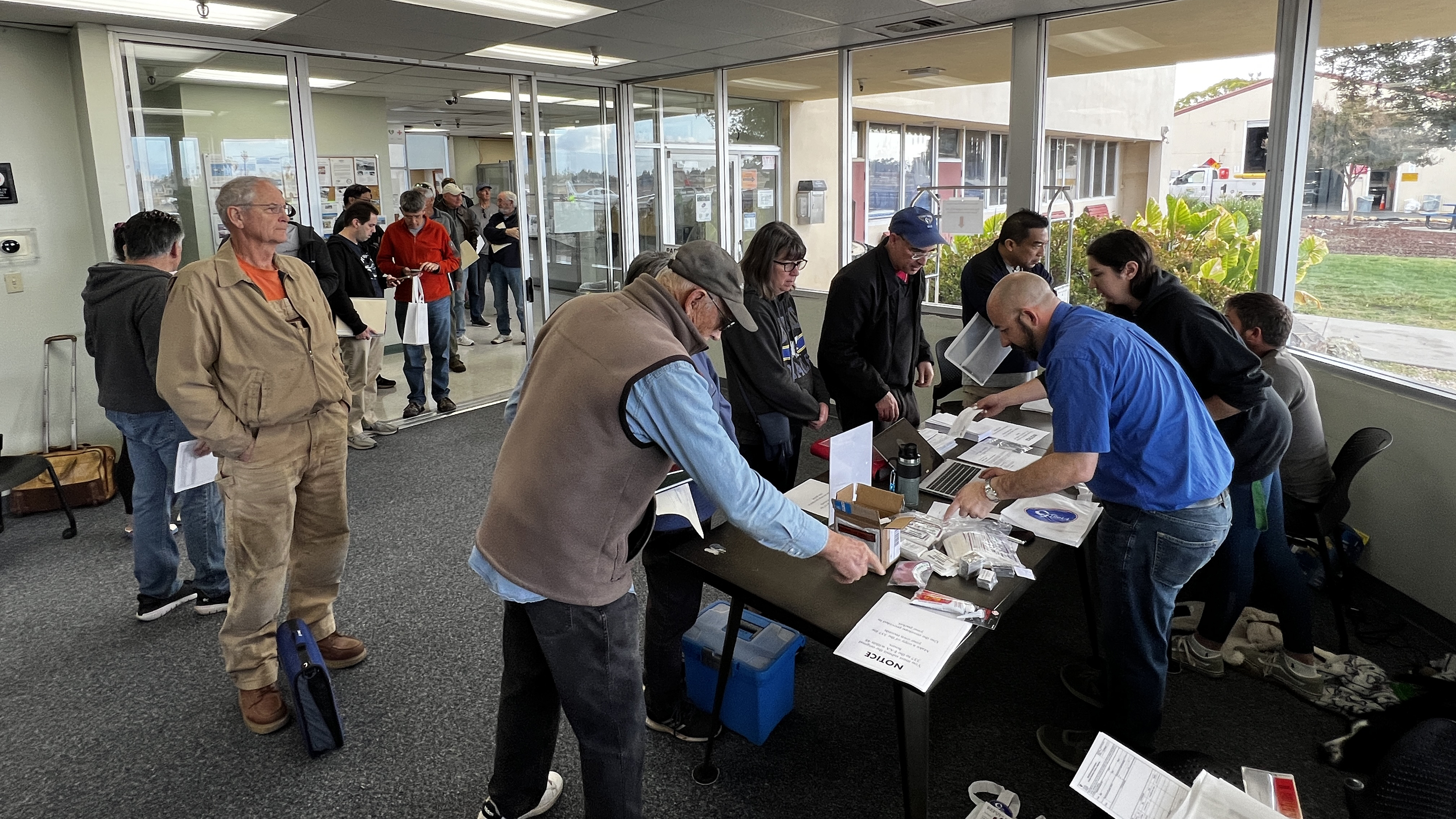 Pilots wait to receive their paperwork and placards at the General Aviation Modifications Inc. G100UL rollout event at Reid-Hillview of Santa Clara County airport in California on November 2. Photo by The 111th Photography.