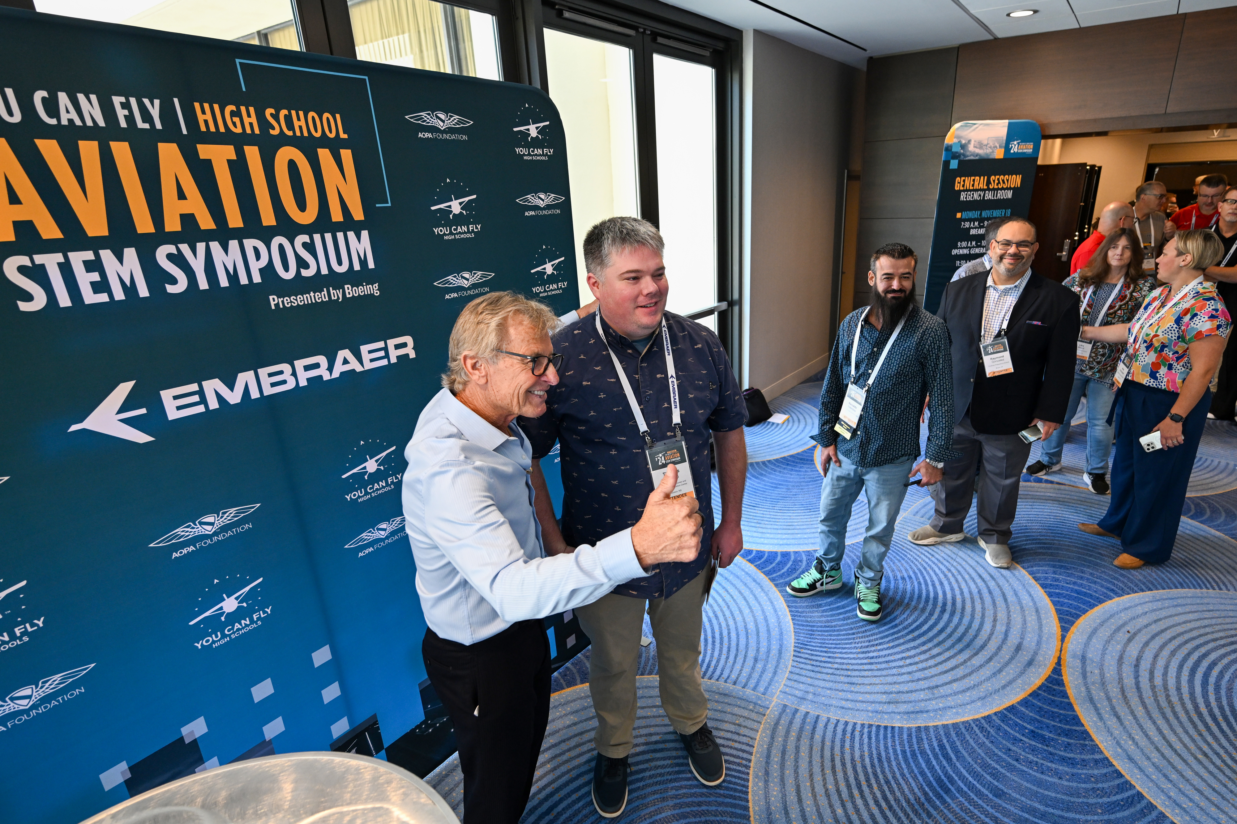Sean D. Tucker greets participants after delivering a keynote speech. Photo by David Tulis.